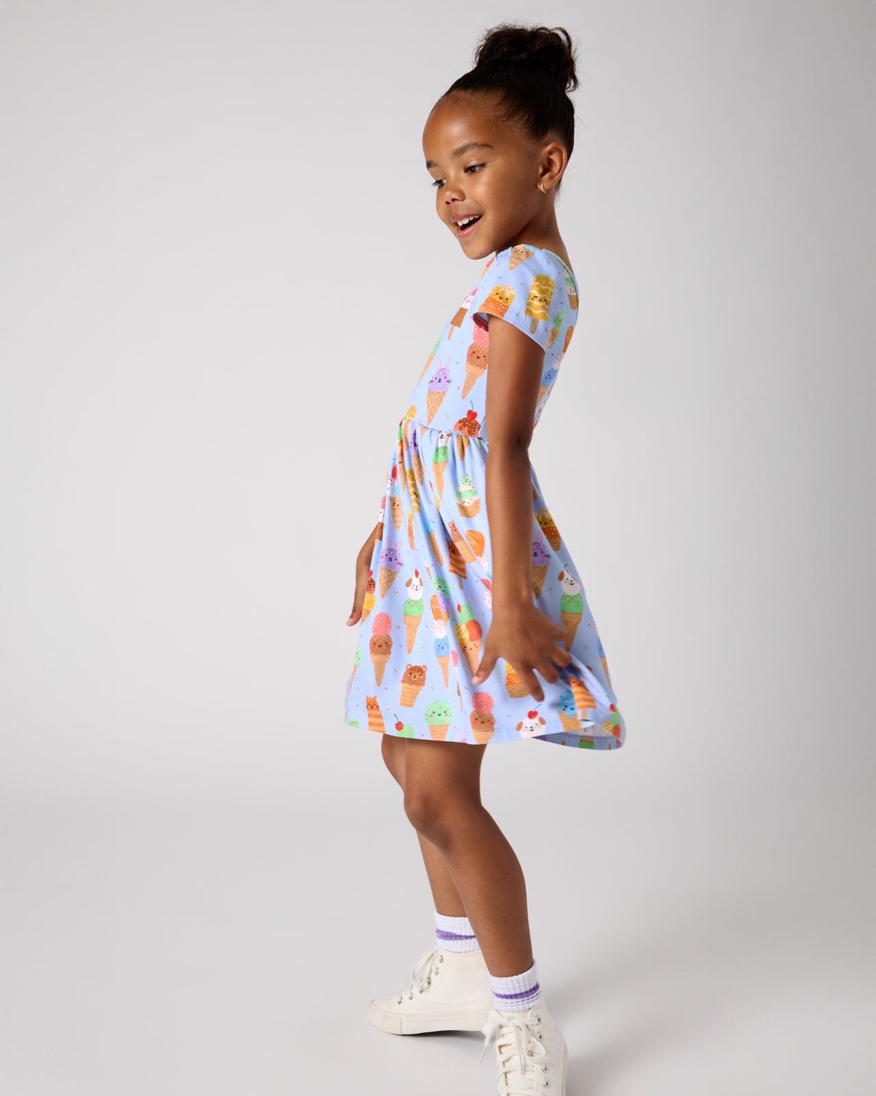 Girl wearing the Scoop Squad Skater Dress