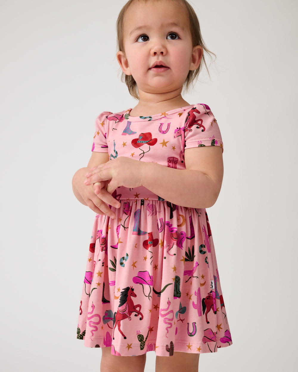 Close up of toddler wearing the Pink Rancher Roundup Skater Dress with Bodysuit