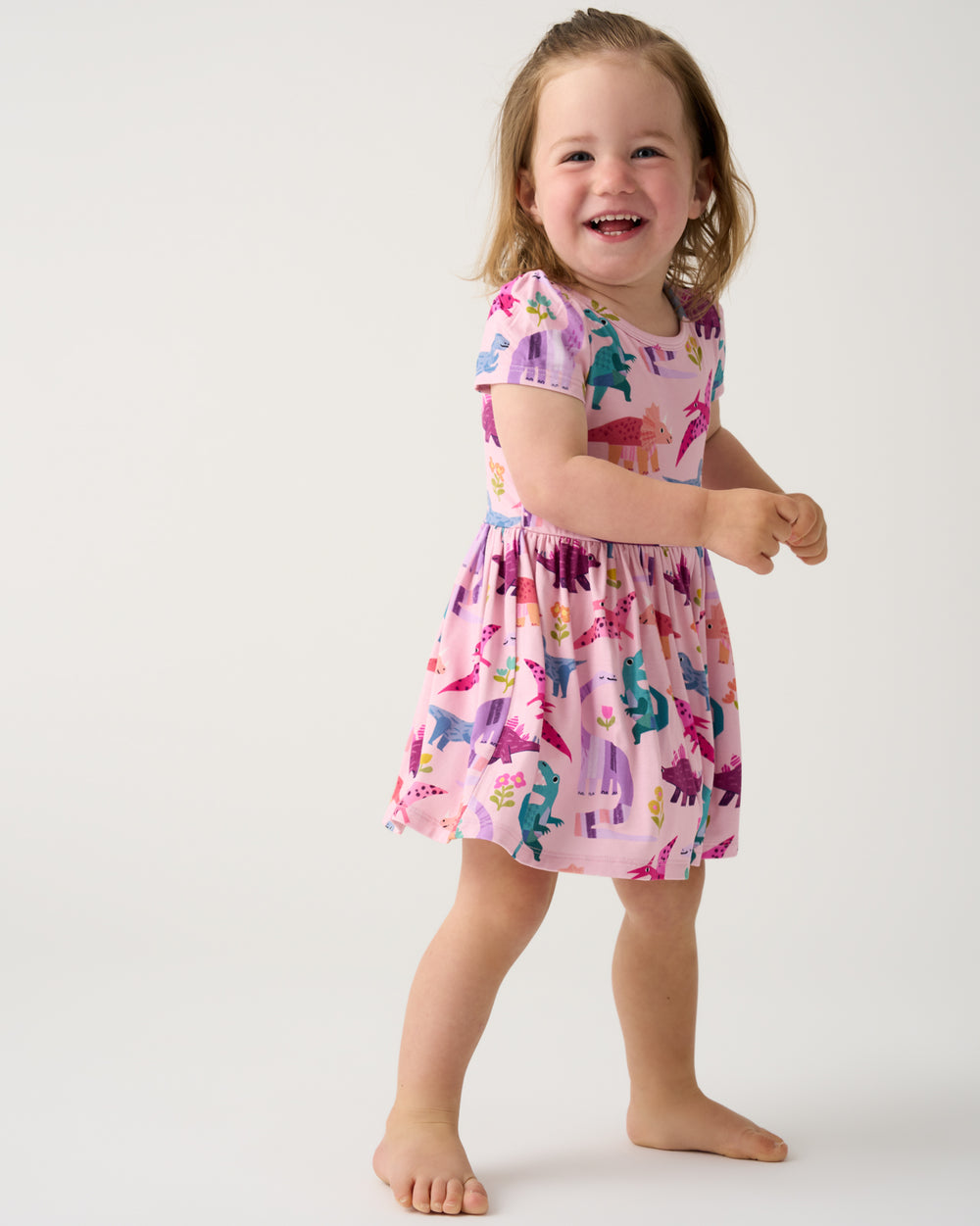 Girl wearing the Roar & Explore Skater Dress with Bodysuit