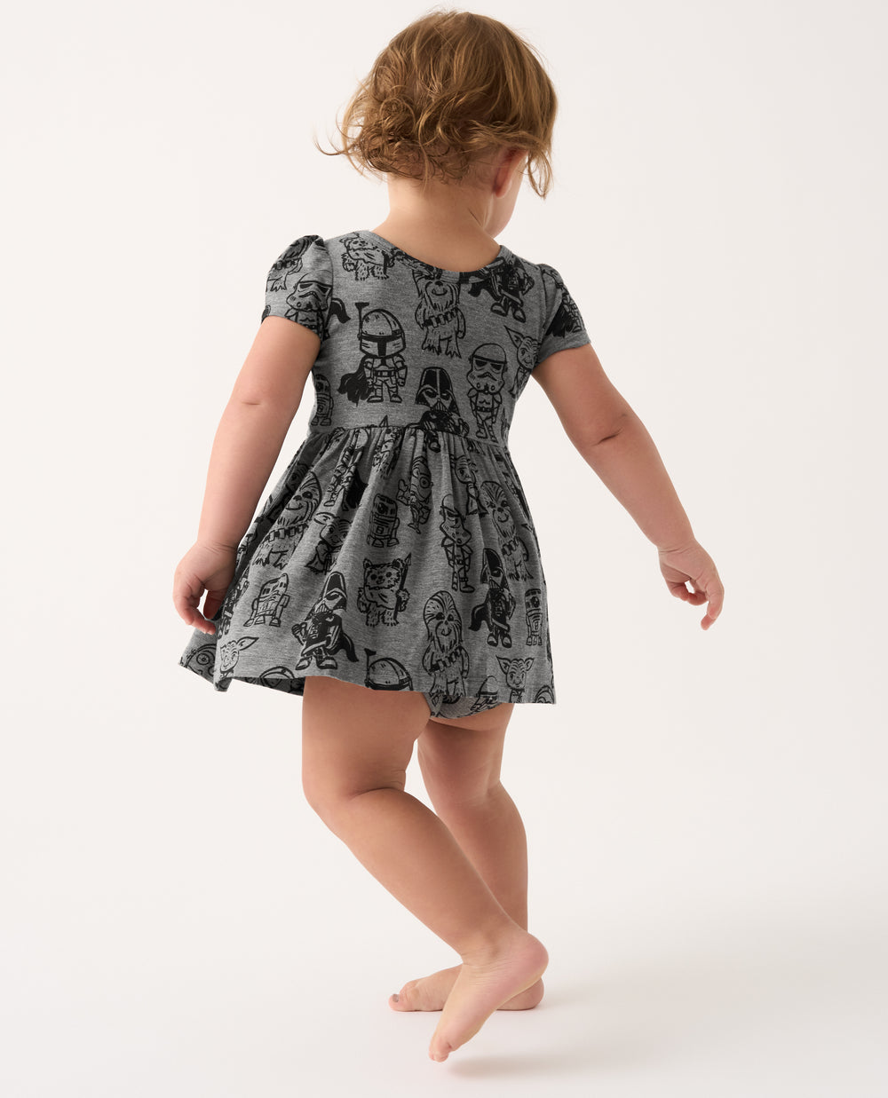 Back view of toddler wearing the Star Wars Far, Far, Away Friends Skater Dress with Bodysuit