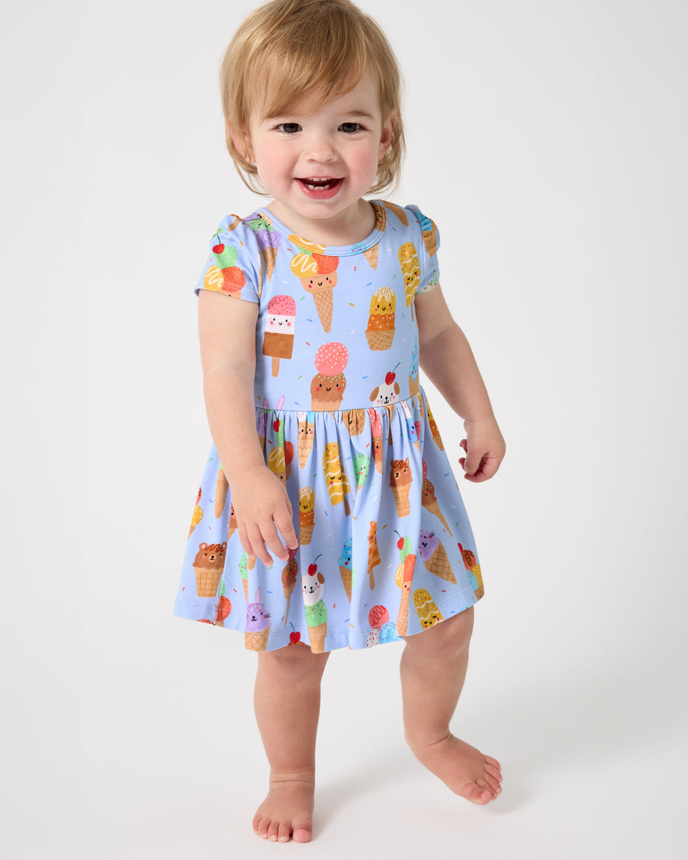 Walking baby wearing the Scoop Squad Skater Dress with Bodysuit