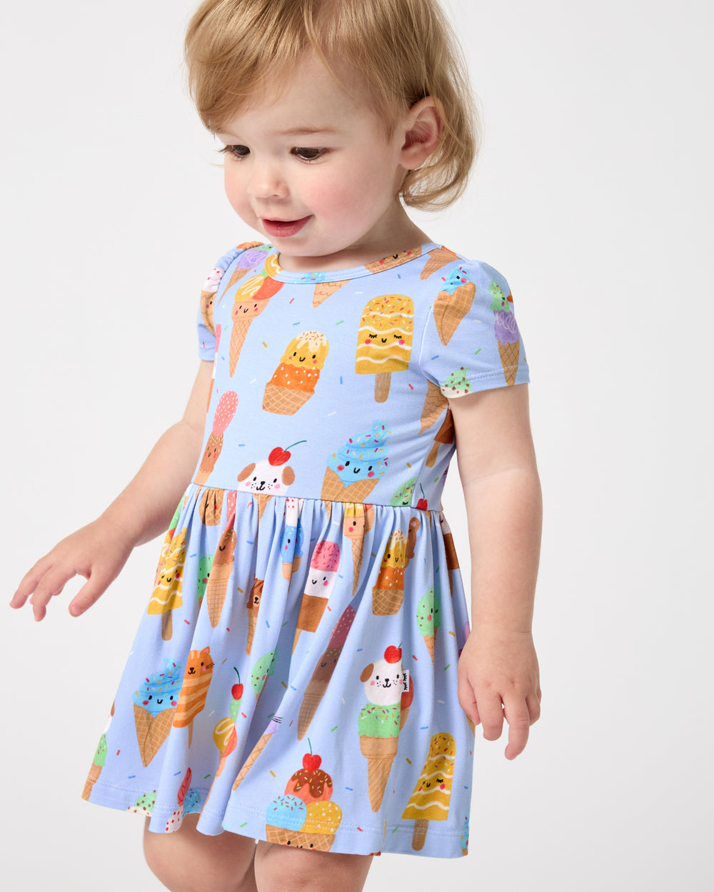 Close up of baby wearing the Scoop Squad Skater Dress with Bodysuit