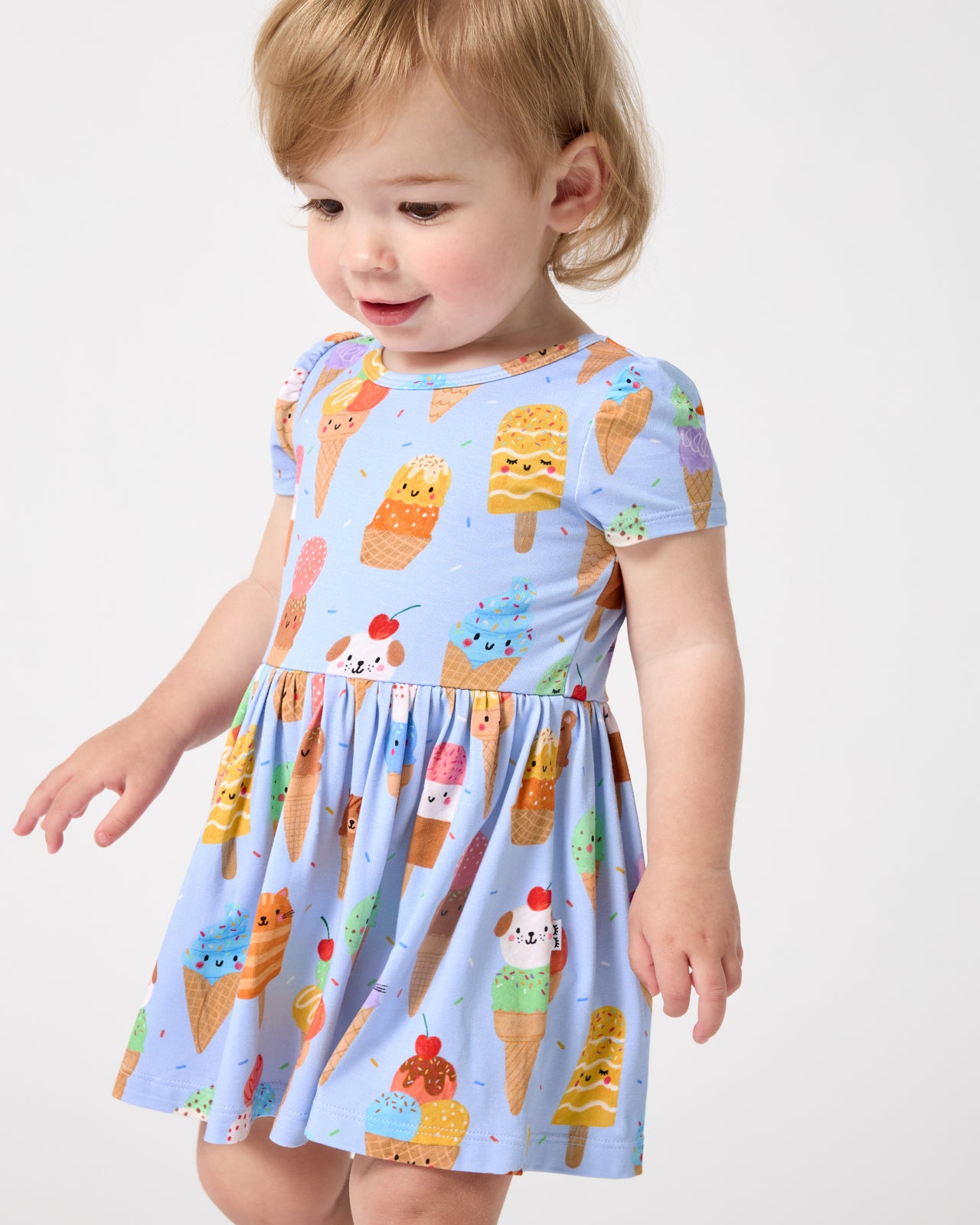 Close up of baby wearing the Scoop Squad Skater Dress with Bodysuit