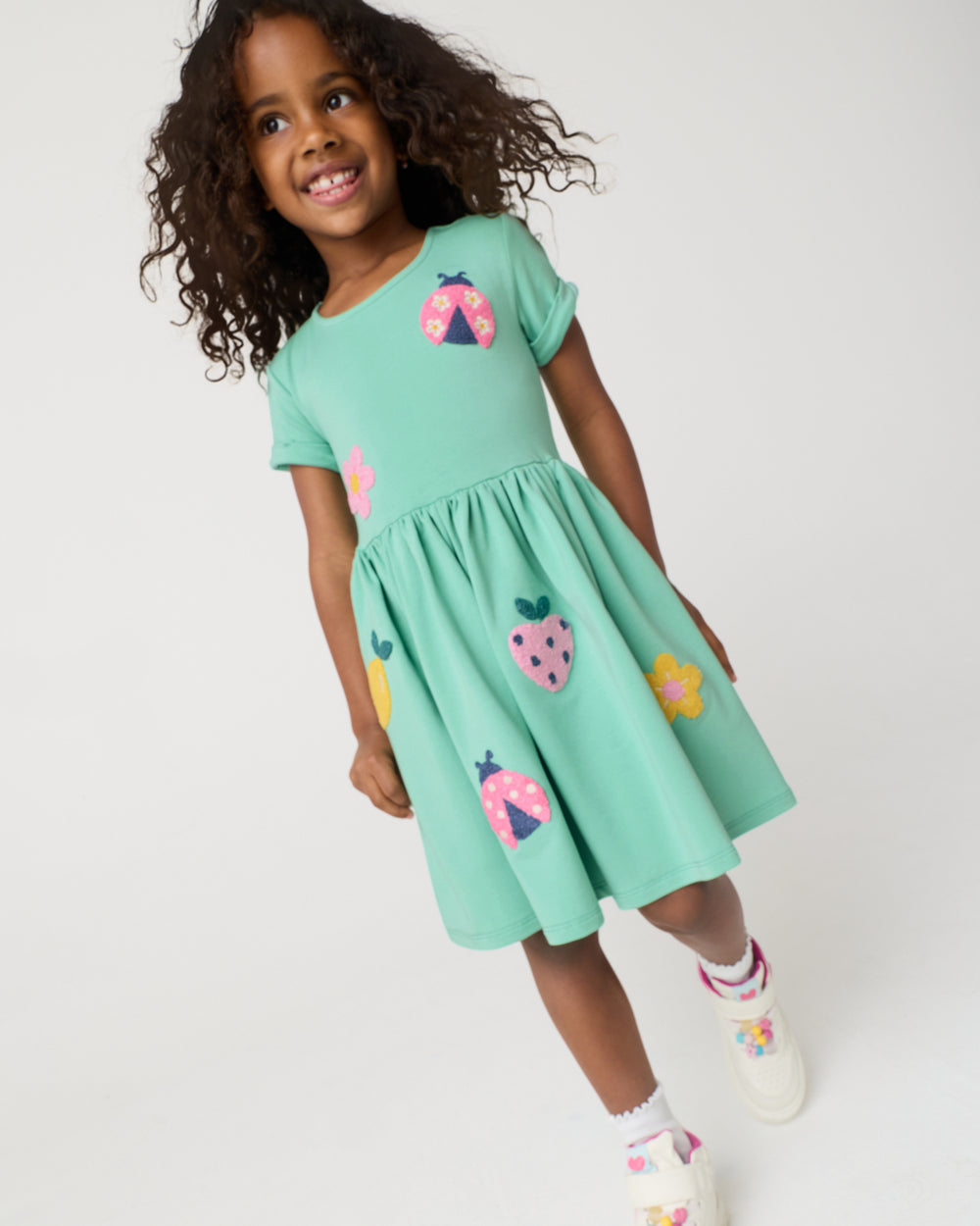 Standing girl wearing the Garden Party Pocket Dress