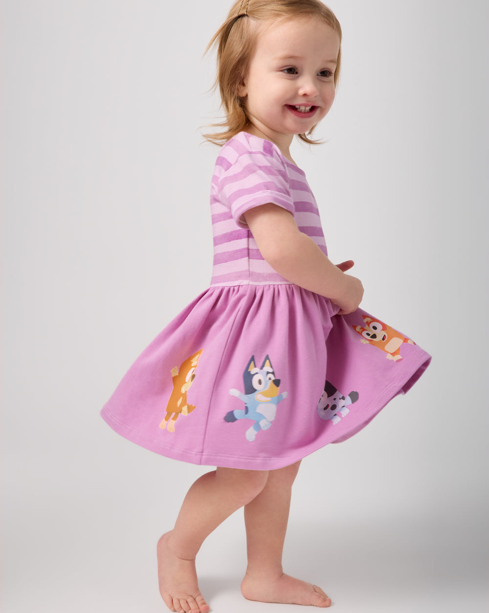 Walking girl wearing the Bluey Friends Forever Dress with Bloomer