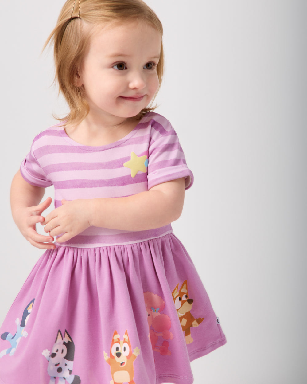 Close up of toddler wearing the Bluey Friends Forever Dress with Bloomer