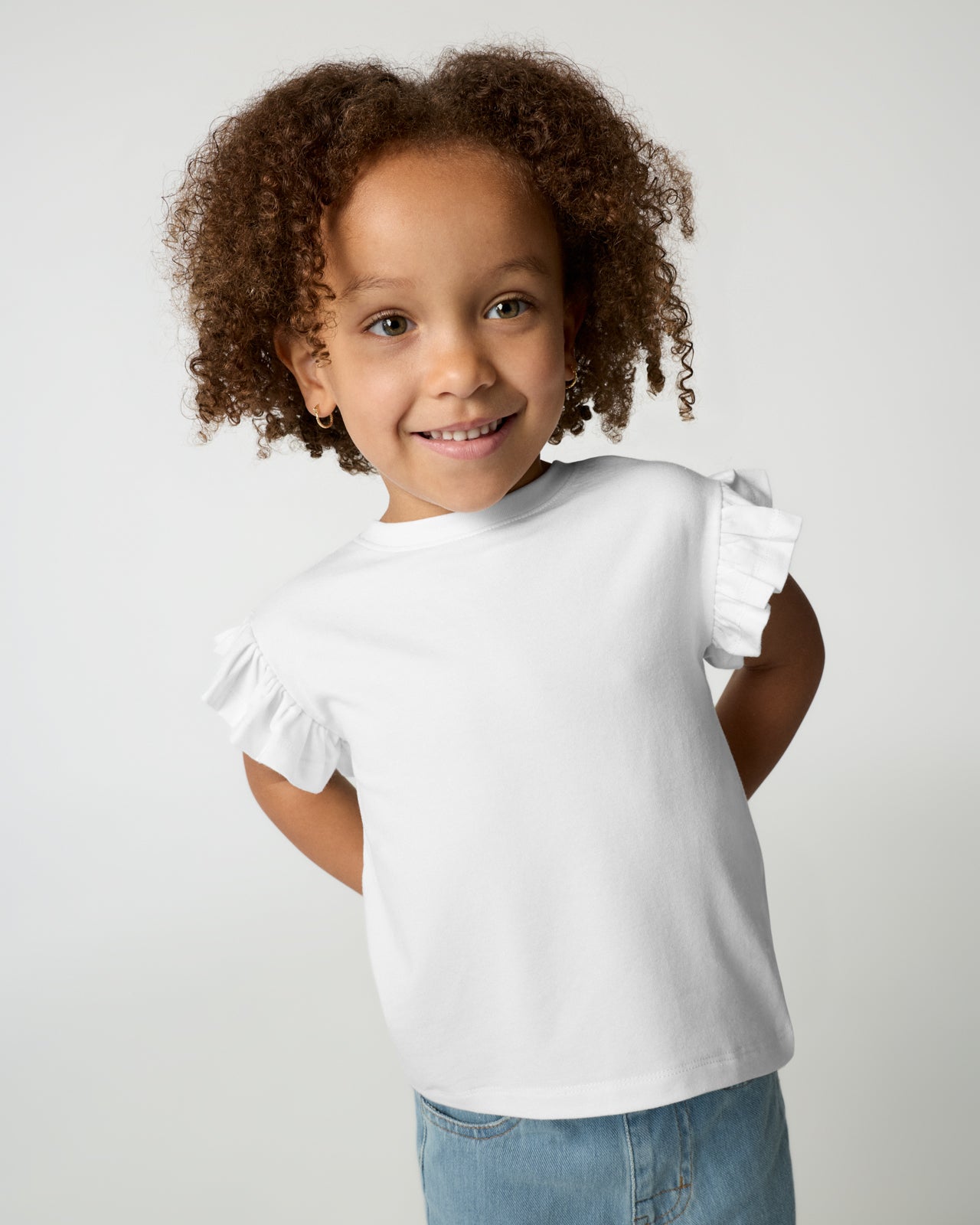 Girl wearing the Bright White Flutter Tee