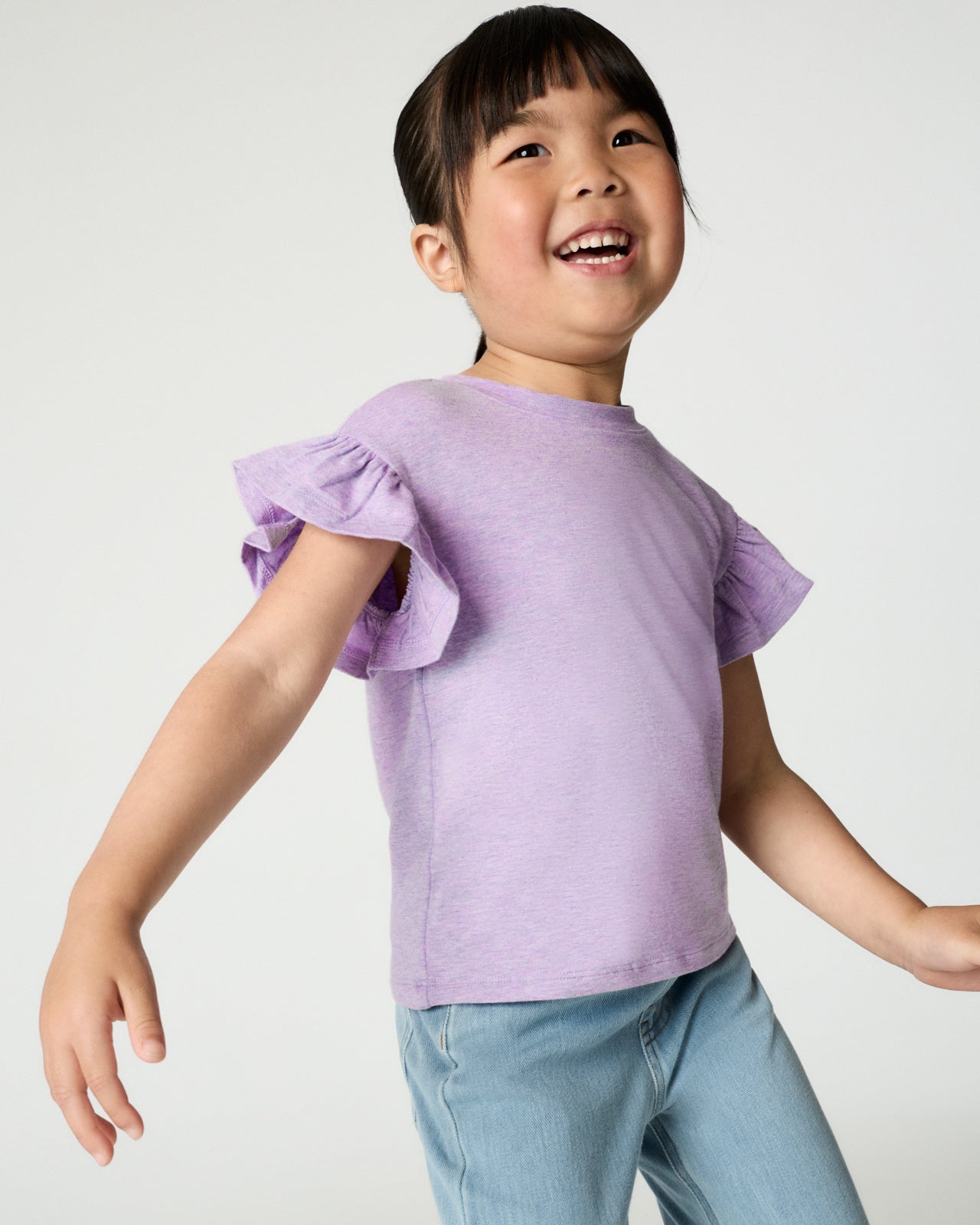 Girl wearing the Heather Lavender Flutter Tee