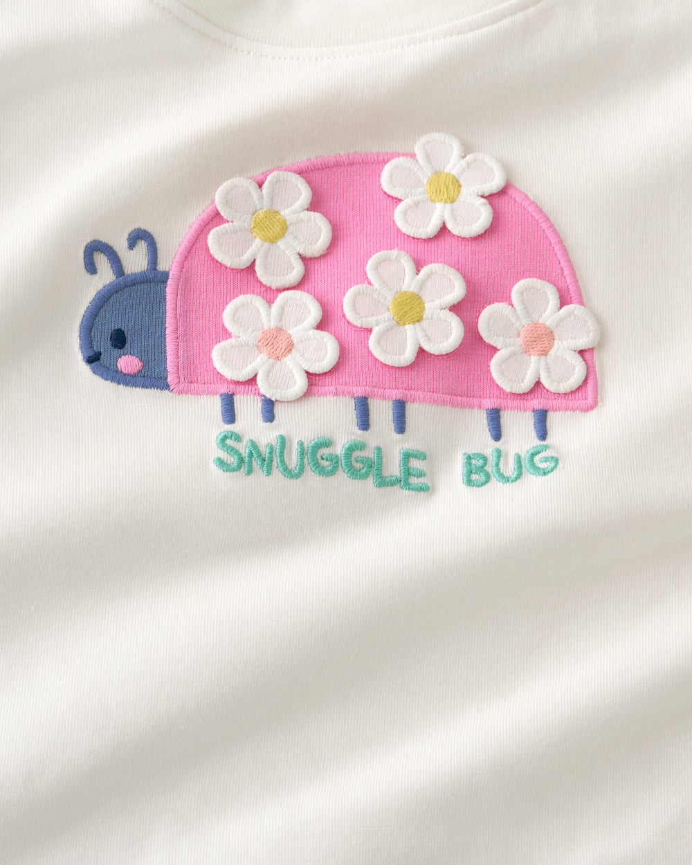 Close up of the graphic detail on the Snuggle Bug Flutter Tee