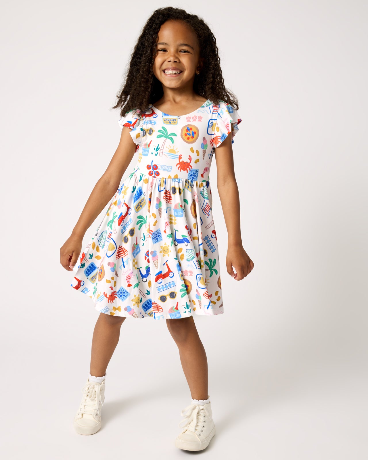 Girl wearing the Ciao Bella Flutter Twirl Dress
