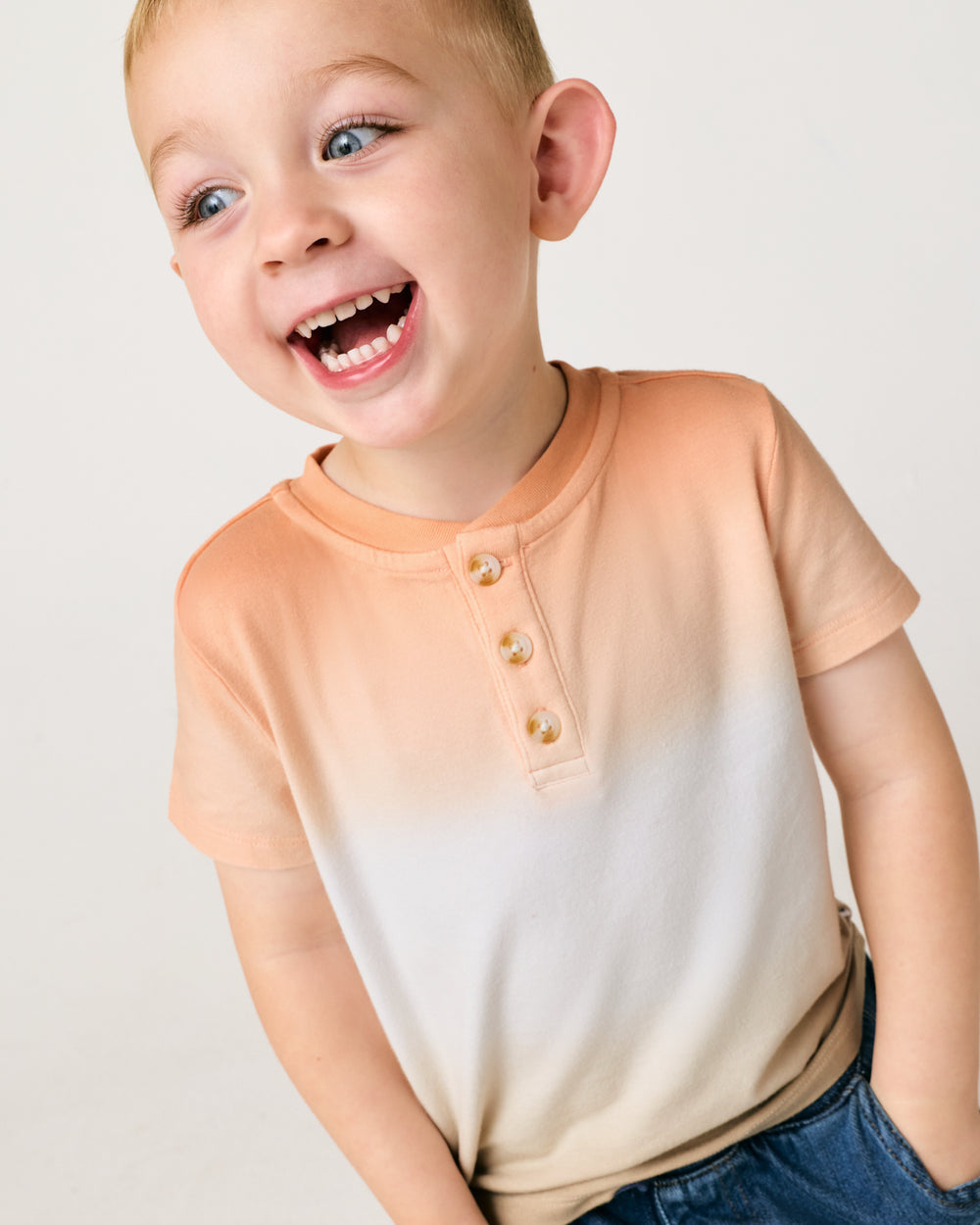 Close up of child wearing the Golden Hour Henley Tee