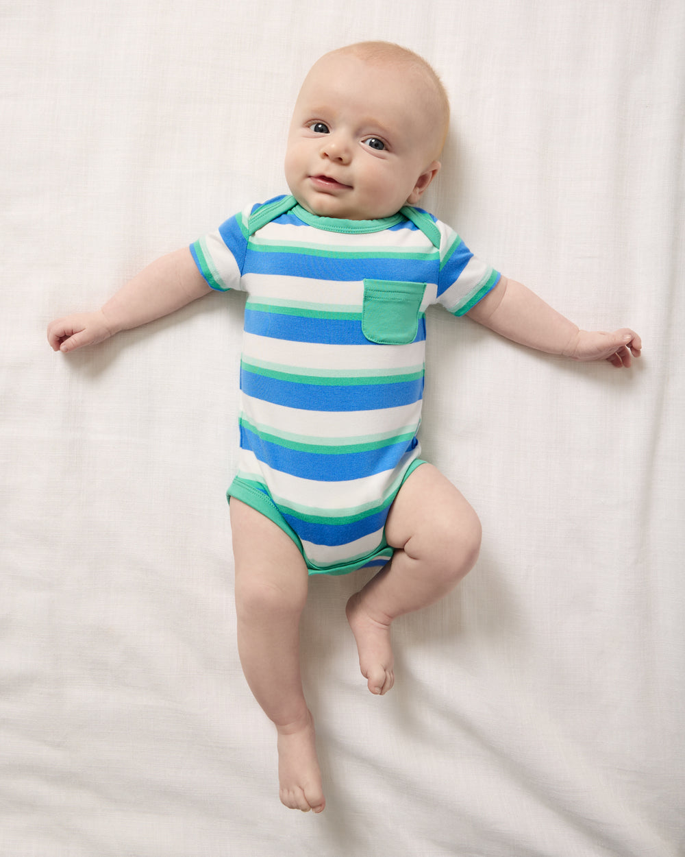 Aerial view of baby wearing the Blue Bolt Stripes Pocket Bodysuit