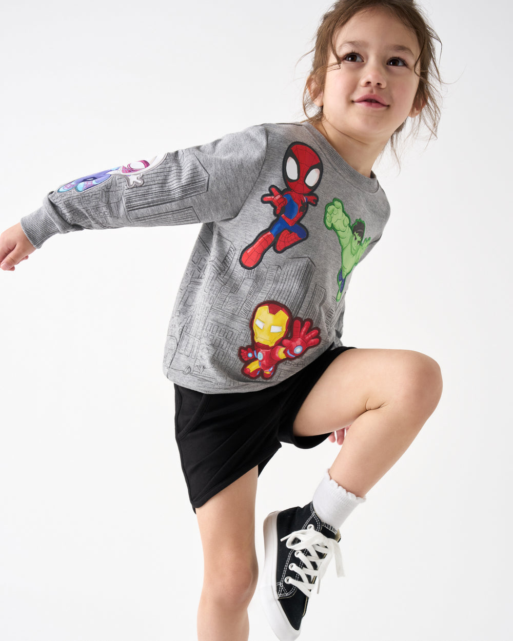 Child in motion wearing the Spidey & Friends Mighty City Heroes Crewneck Sweatshirt