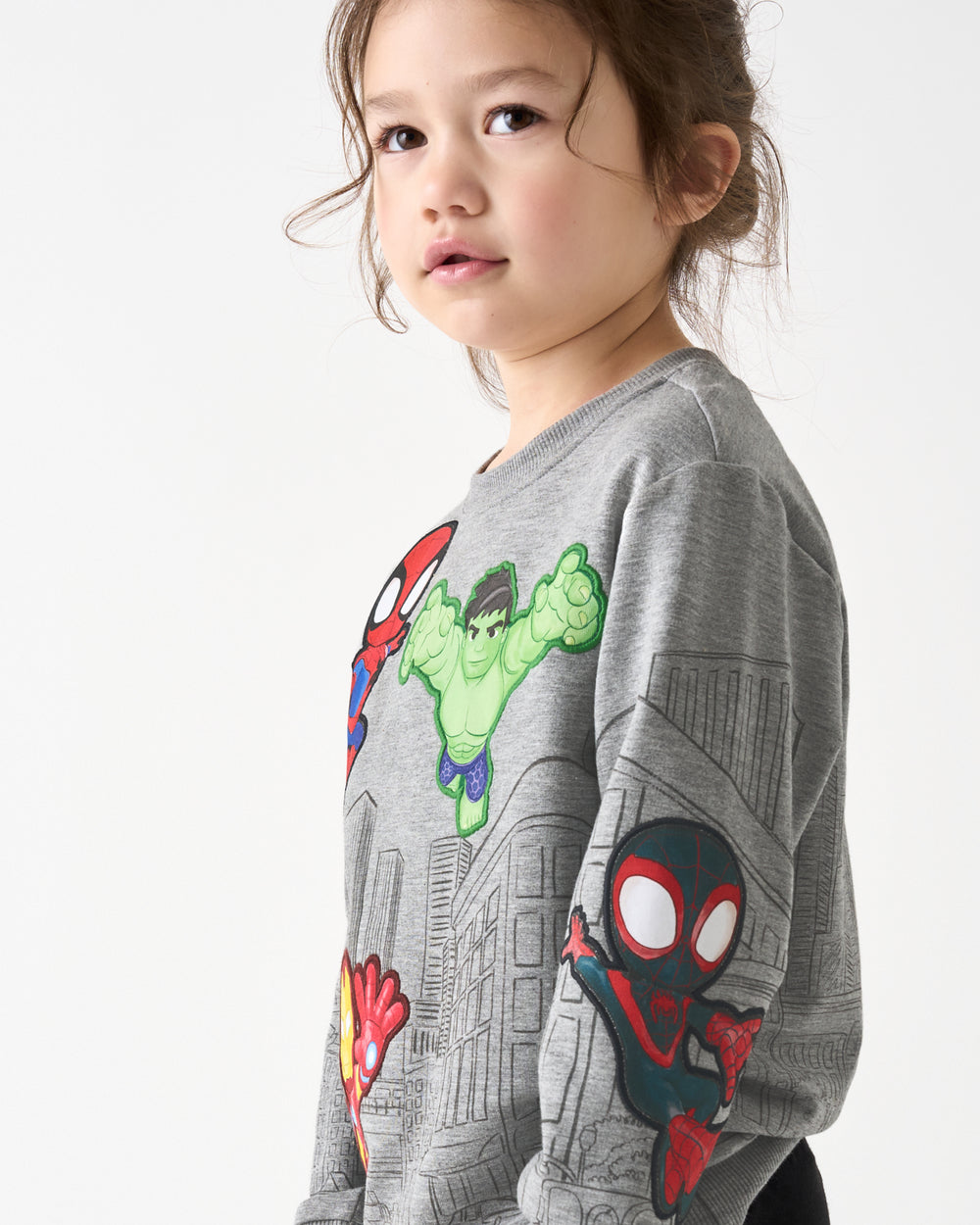 Close up of girl wearing the Spidey & Friends Mighty City Heroes Crewneck Sweatshirt