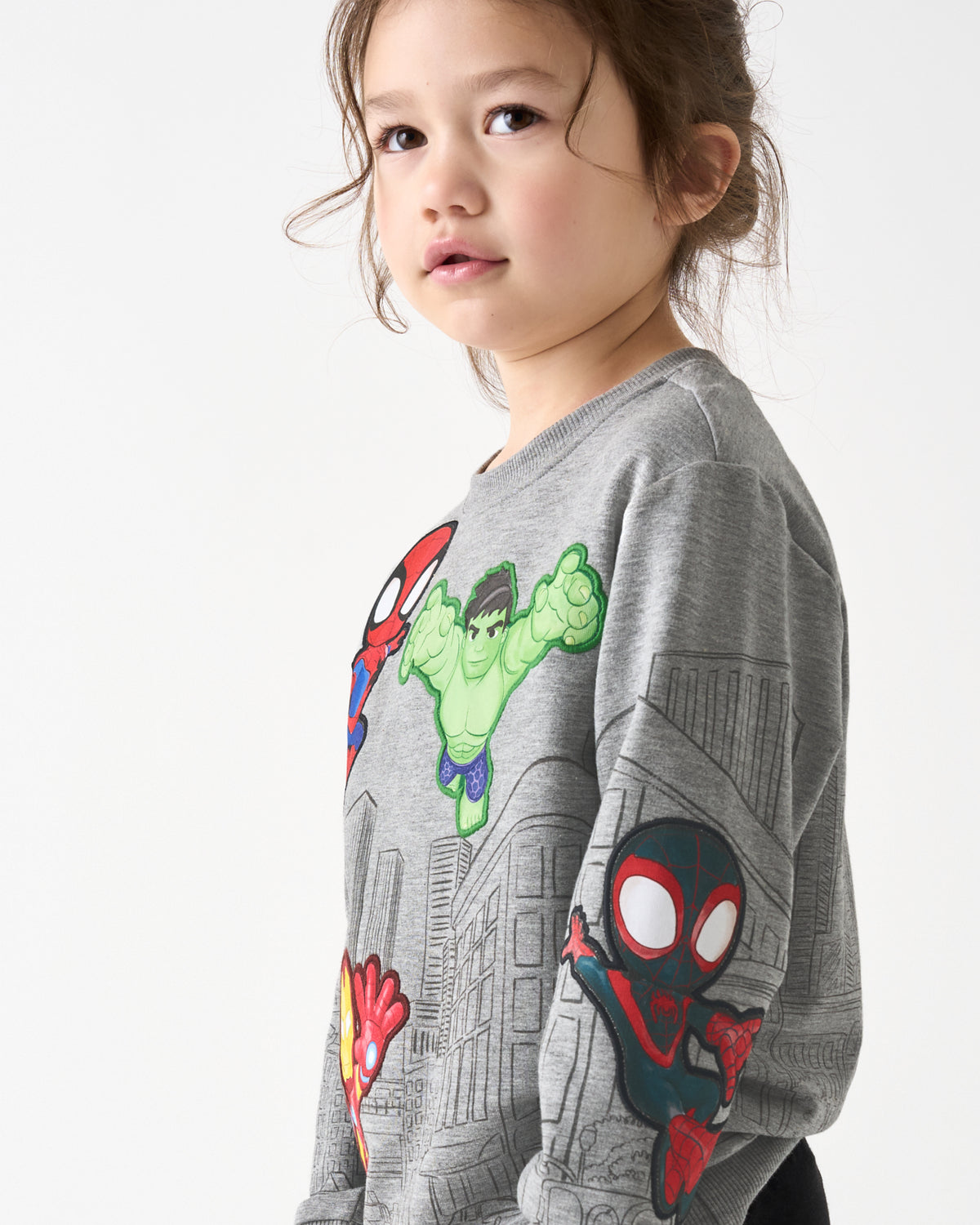 Close up of girl wearing the Spidey & Friends Mighty City Heroes Crewneck Sweatshirt