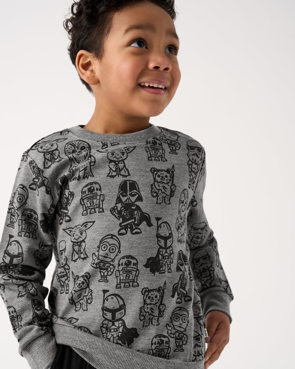 Close up of boy wearing the Star Wars Far, Far, Away Friends Crewneck Sweatshirt