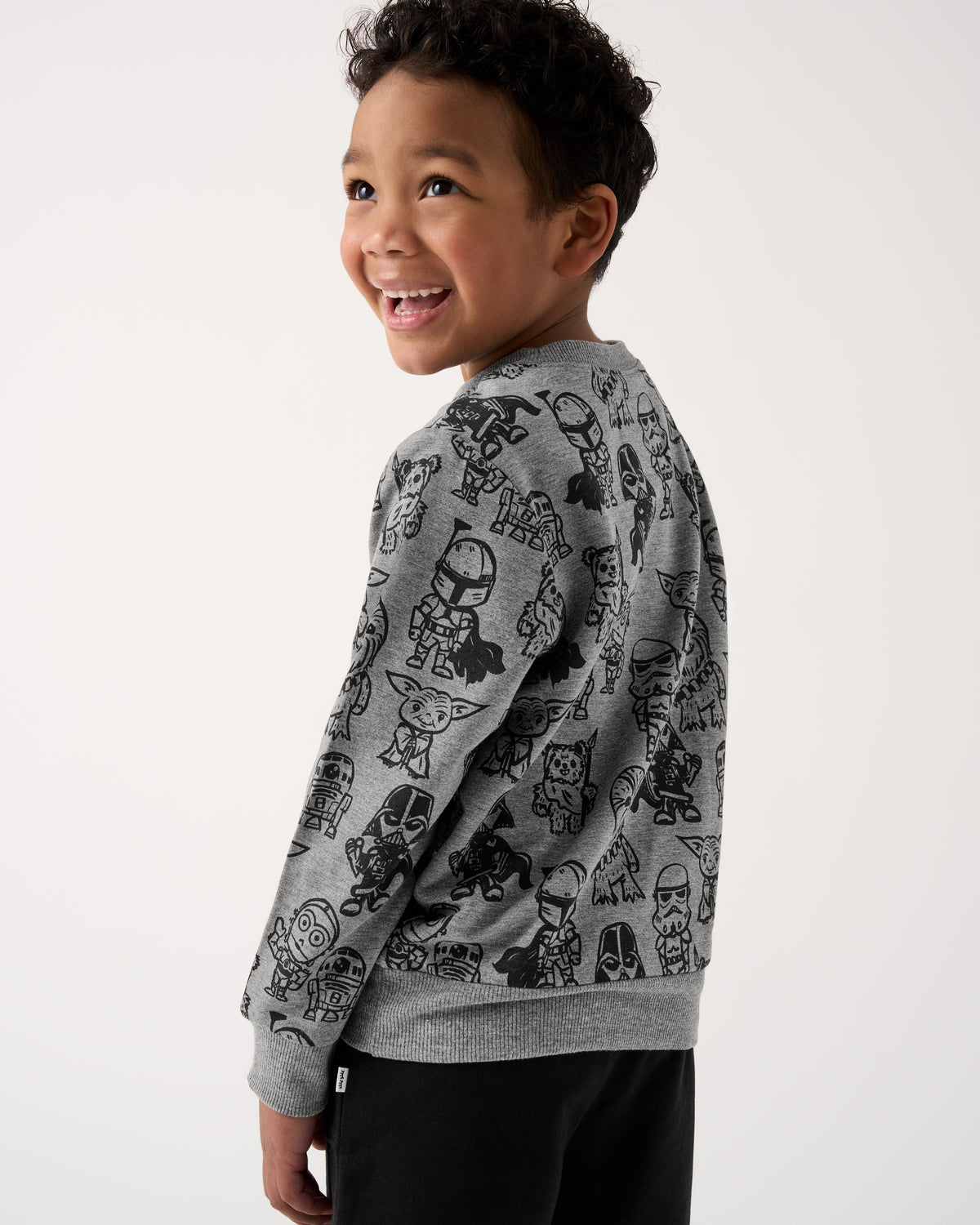 Back view of boy wearing the Star Wars Far, Far, Away Friends Crewneck Sweatshirt