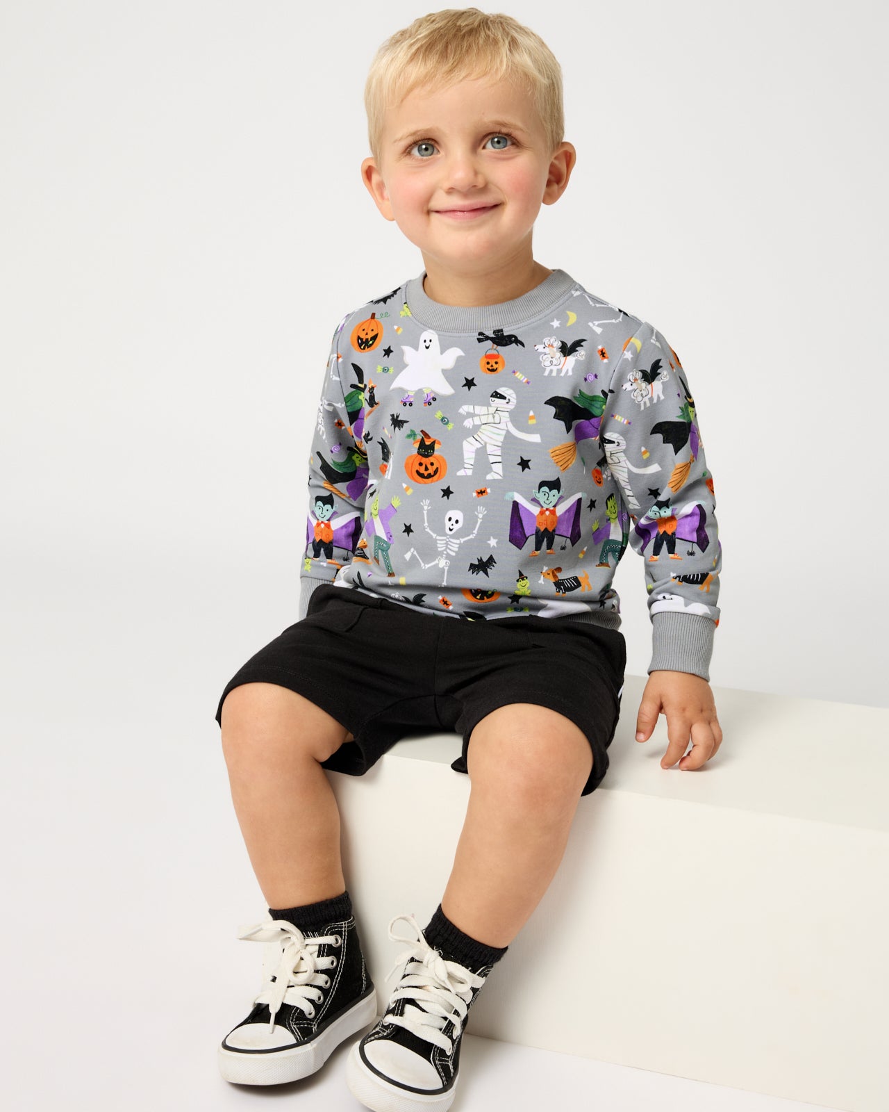 Boy wearing the Dracula's Disco Crewneck Sweatshirt with black shorts