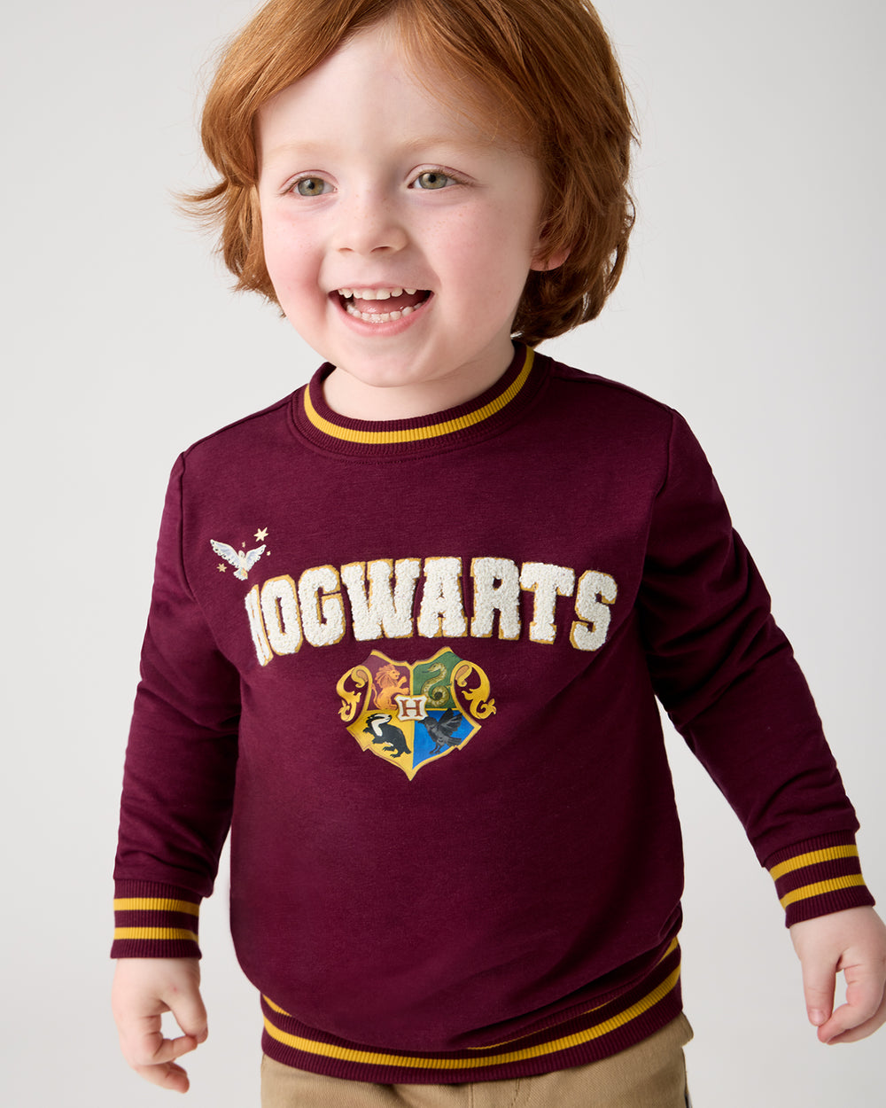 Boy wearing the Harry Potter™ Spellbinding Studies Crewneck Sweatshirt