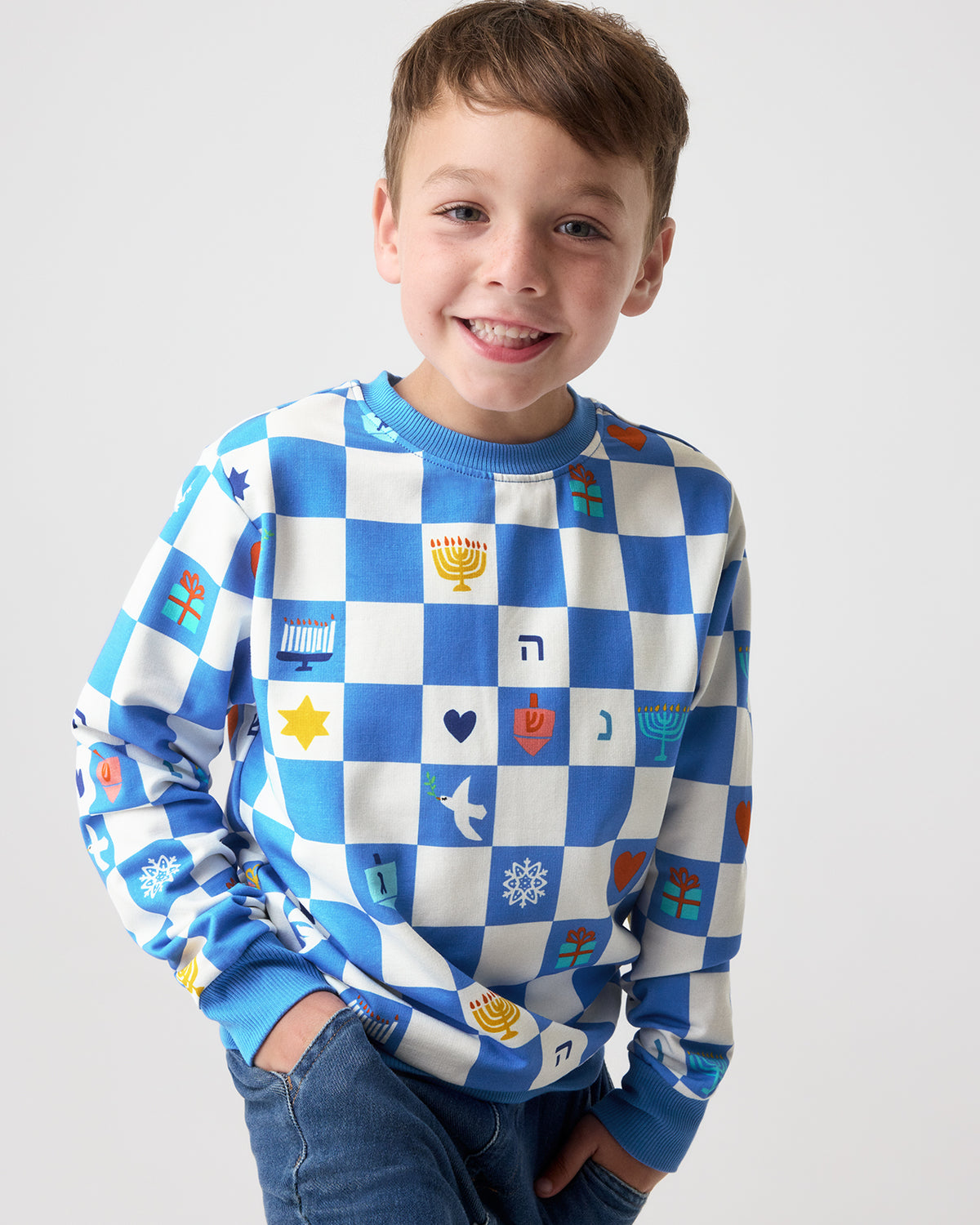 Close up of boy wearing the Hanukkah Checks Crewneck Sweatshirt