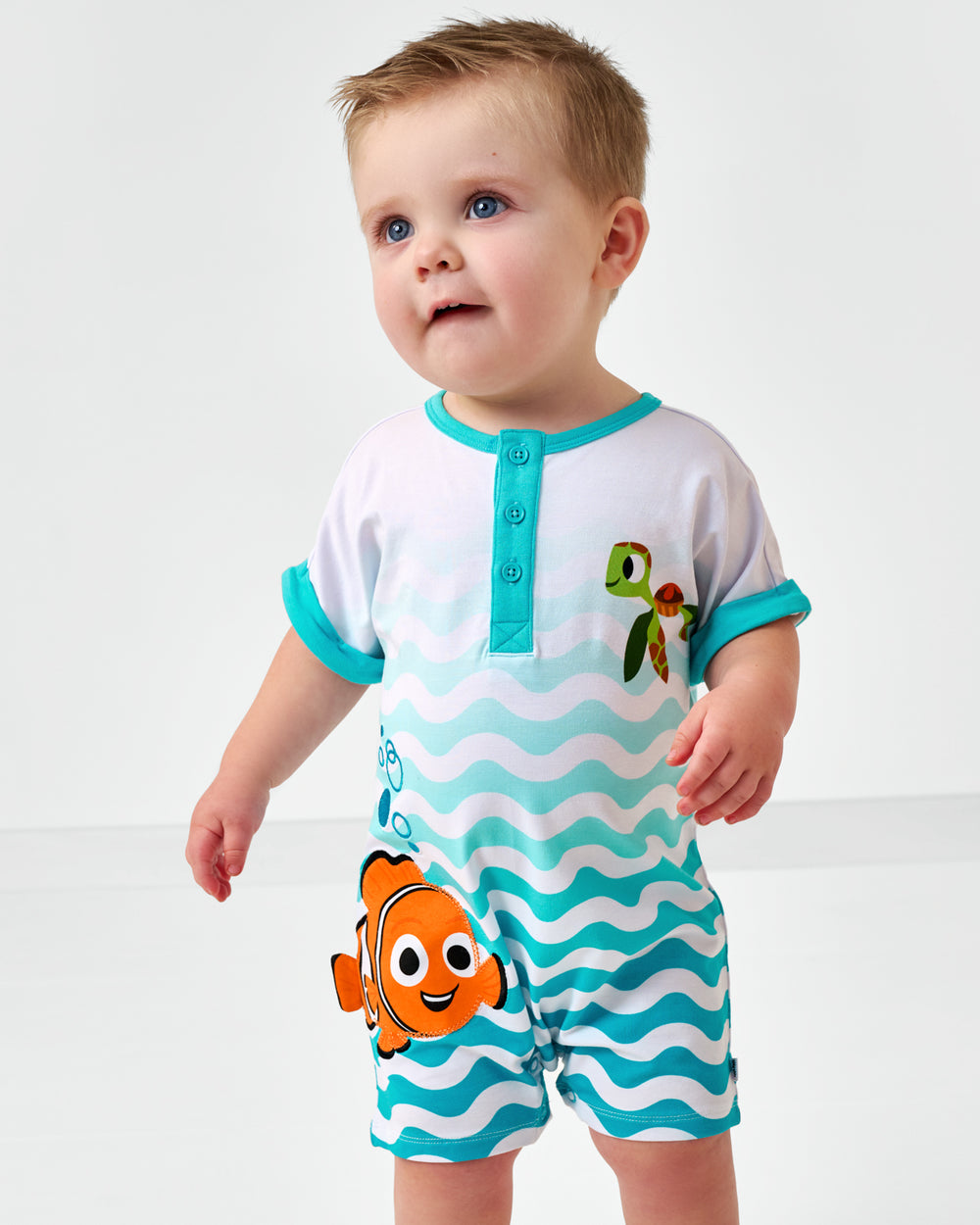 Close up of child wearing the Disney Nemo Dolman Henley Romper