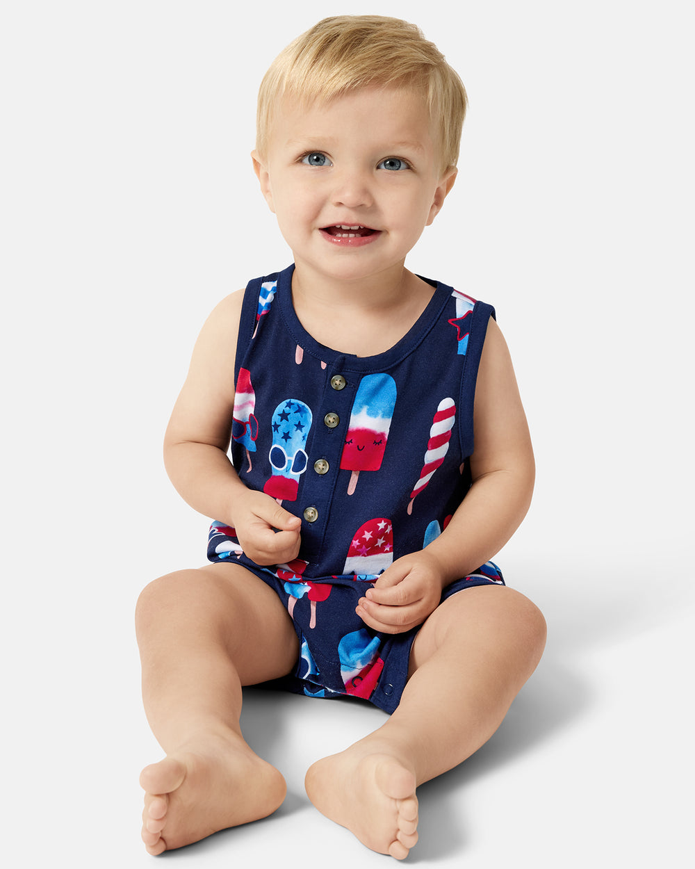 Sitting toddler wearing the Sparkle Treats Henley Romper