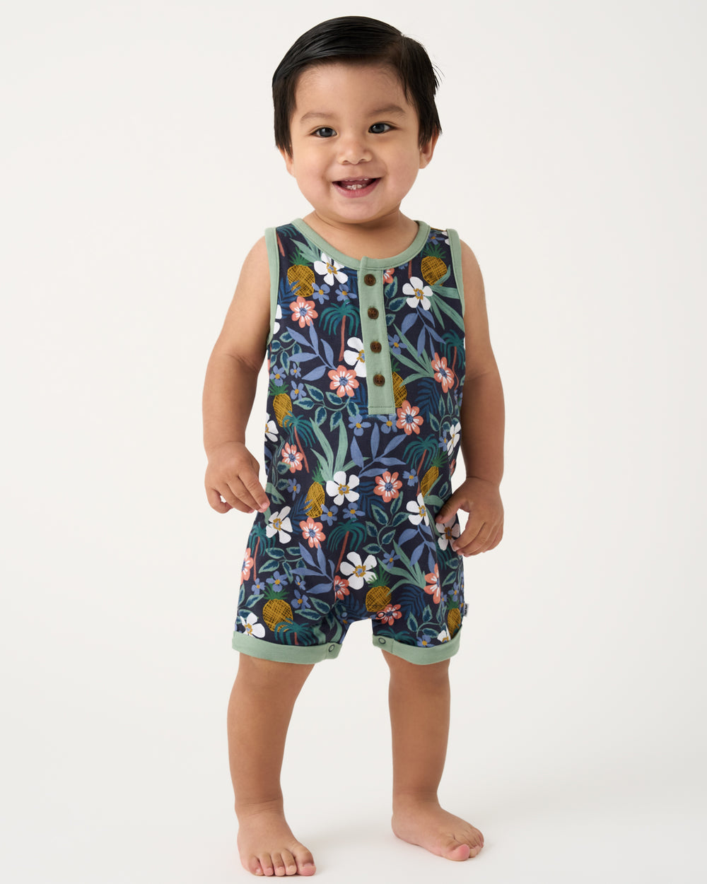 Toddler wearing the Tropical Garden Henley Romper