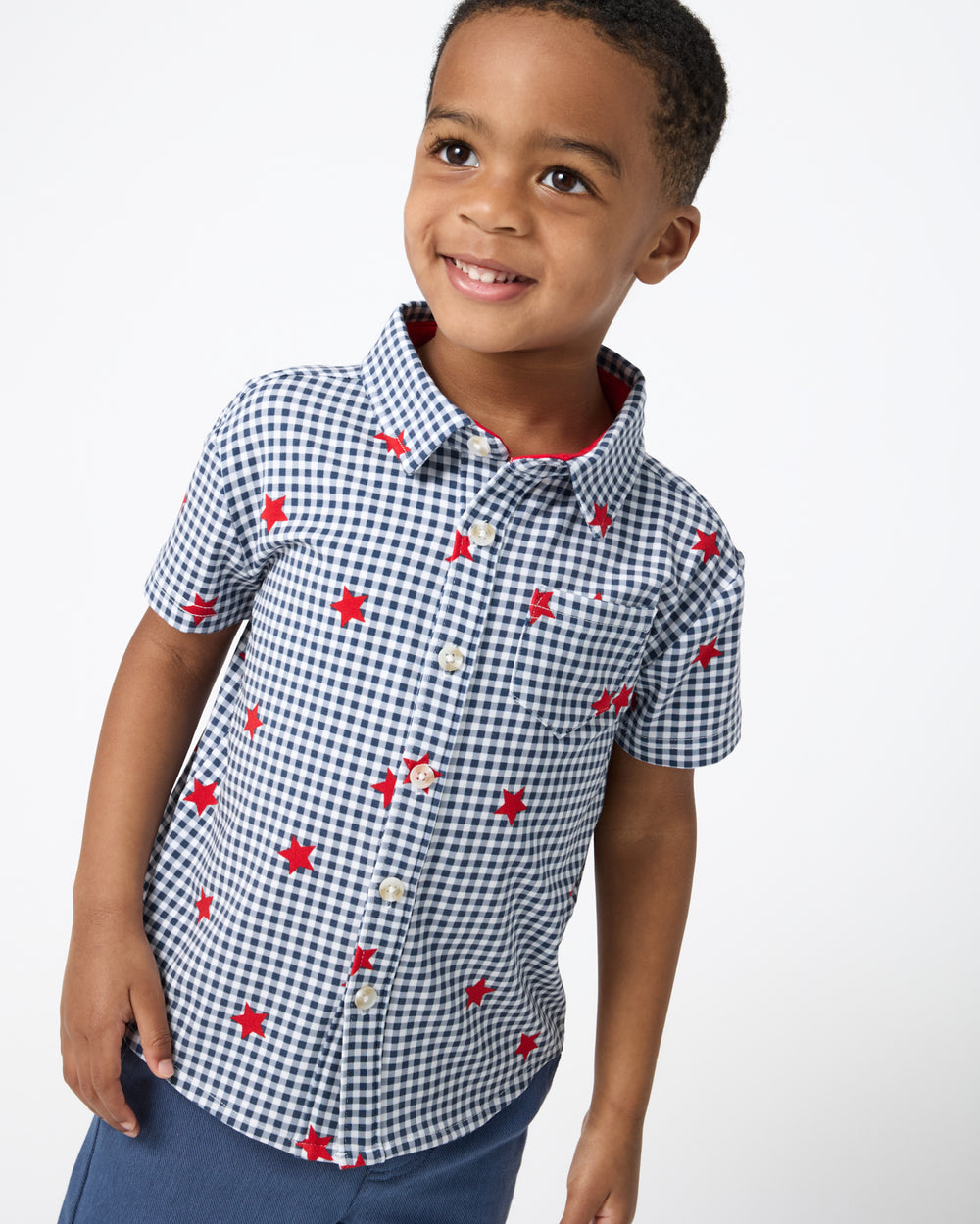 Close up of boy wearing the Blue Ribbon Gingham Button Down Shirt