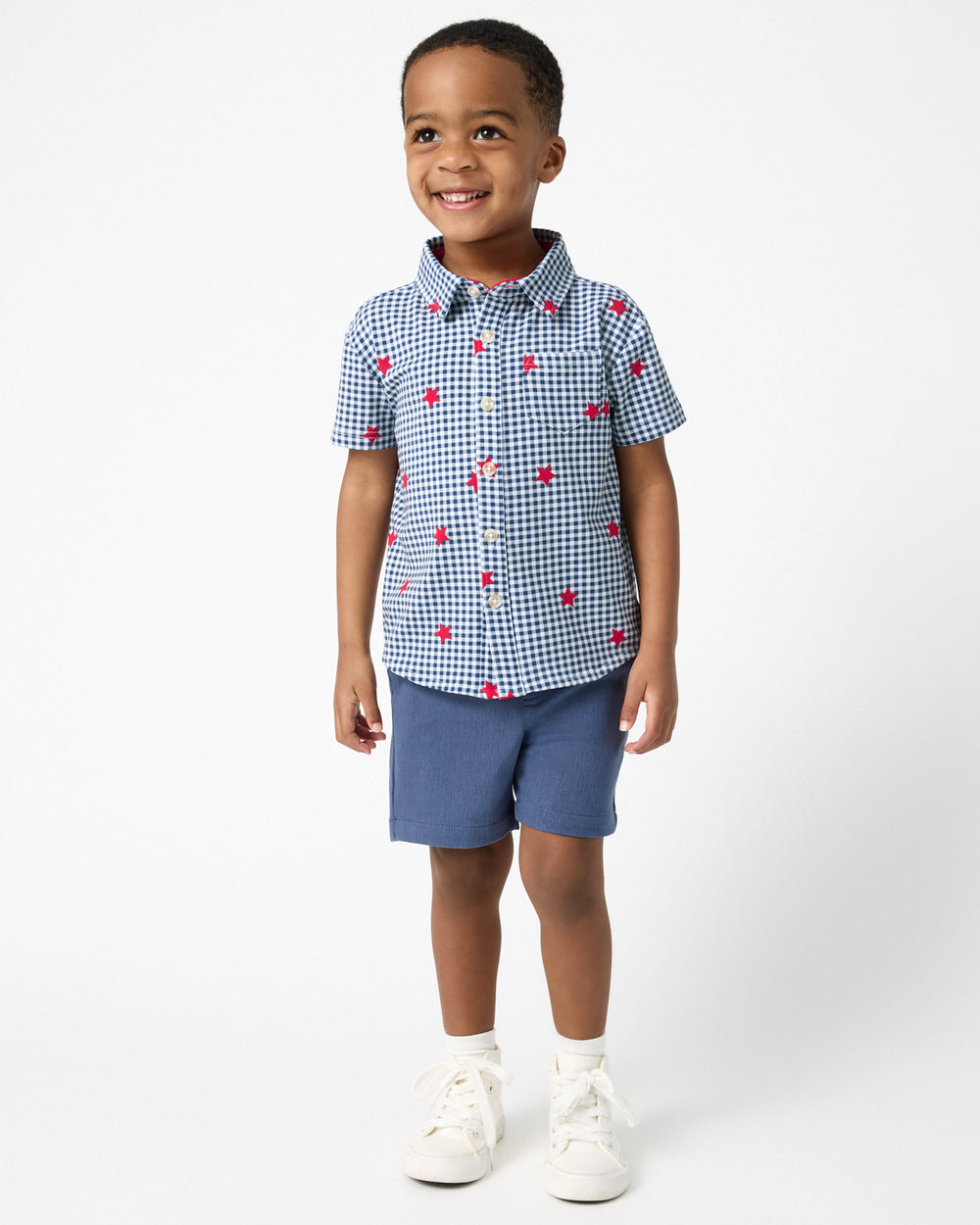 Boy wearing the Blue Ribbon Gingham Button Down Shirt with Navy Shorts