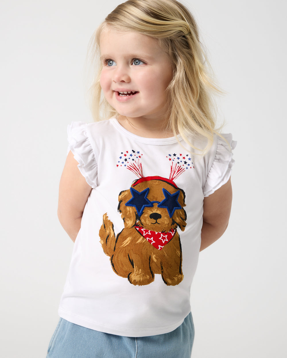 Girl wearing the Star Spangled Pup Flutter Tee