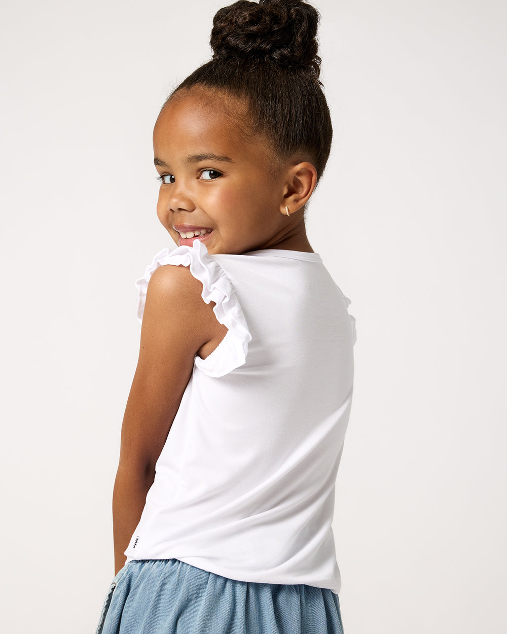 Back view of child wearing the Star Spangled Pup Flutter Tee