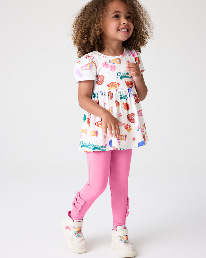 Girl wearing the Pop Pink Bow Legging with the Team Spirit Empire Top