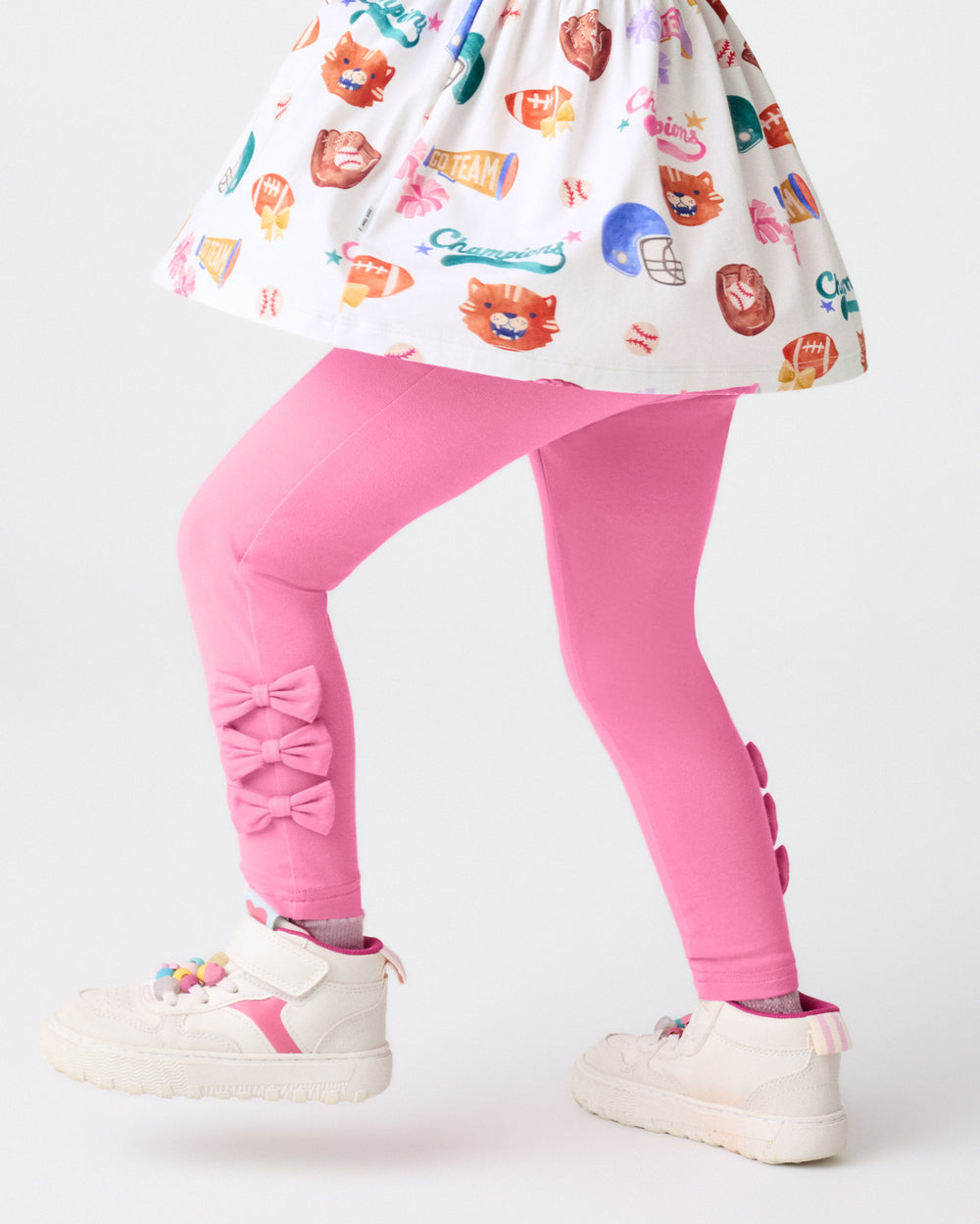 Girl wearing the Pop Pink Bow Legging