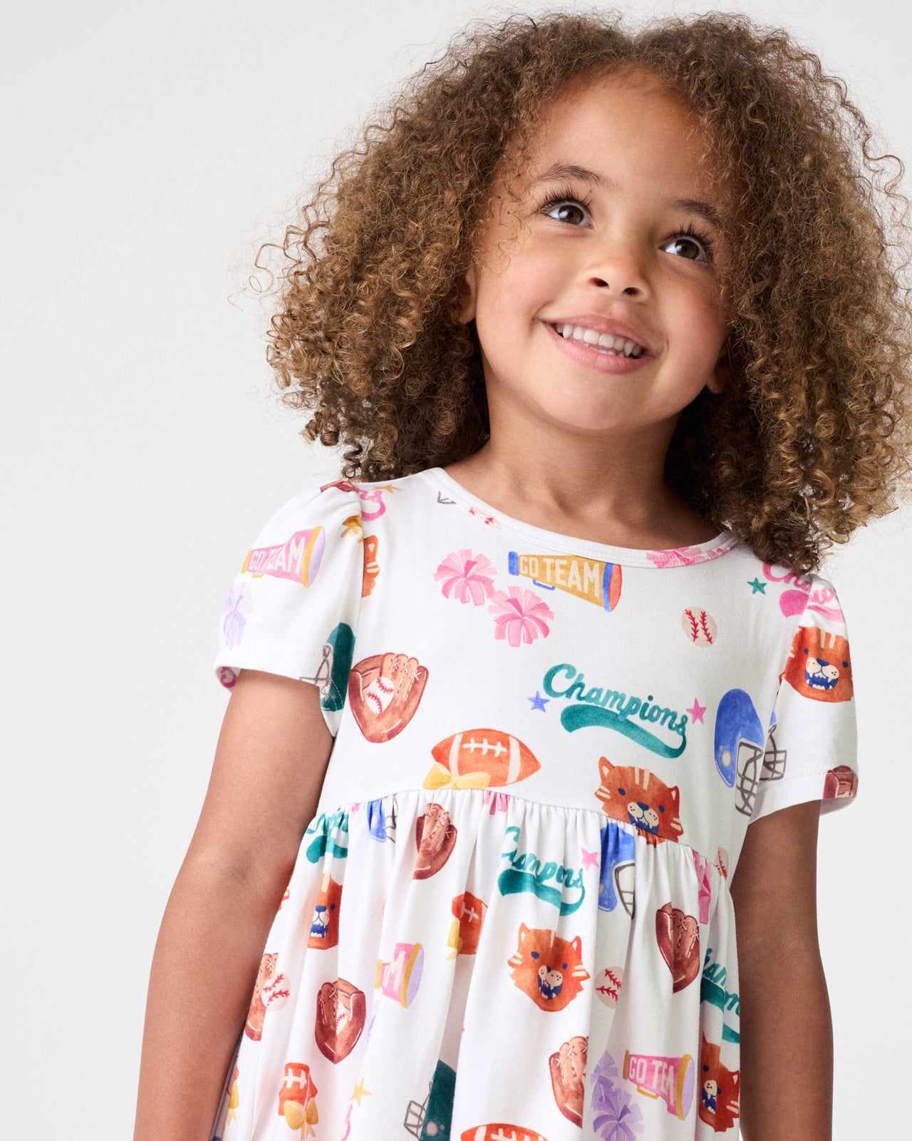 Close up of girl wearing the Team Spirit Empire Tunic Top