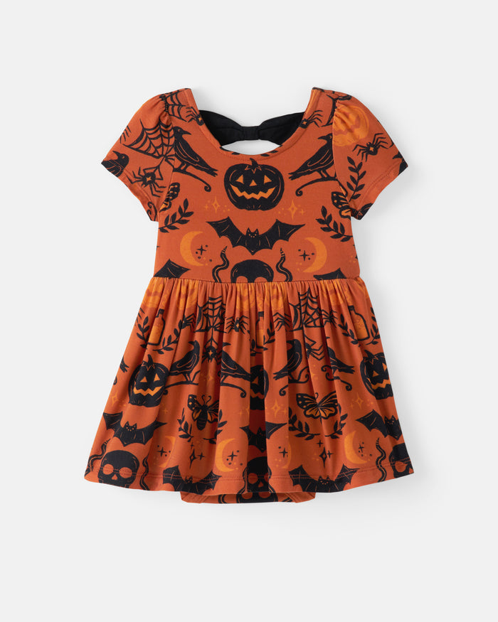 Flat lay of the Midnight Mischief Bow Back Skater Dress with Bodysuit