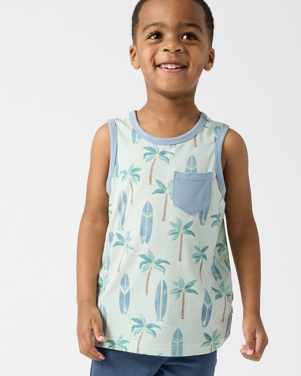 Boy wearing the Palm Dunes Pocket Tank