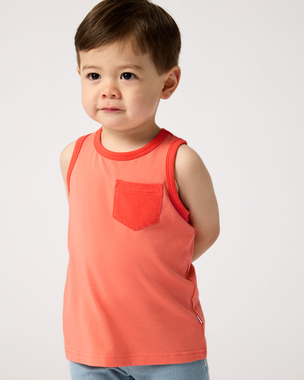Toddler wearing the Orange Crush Pocket Tank