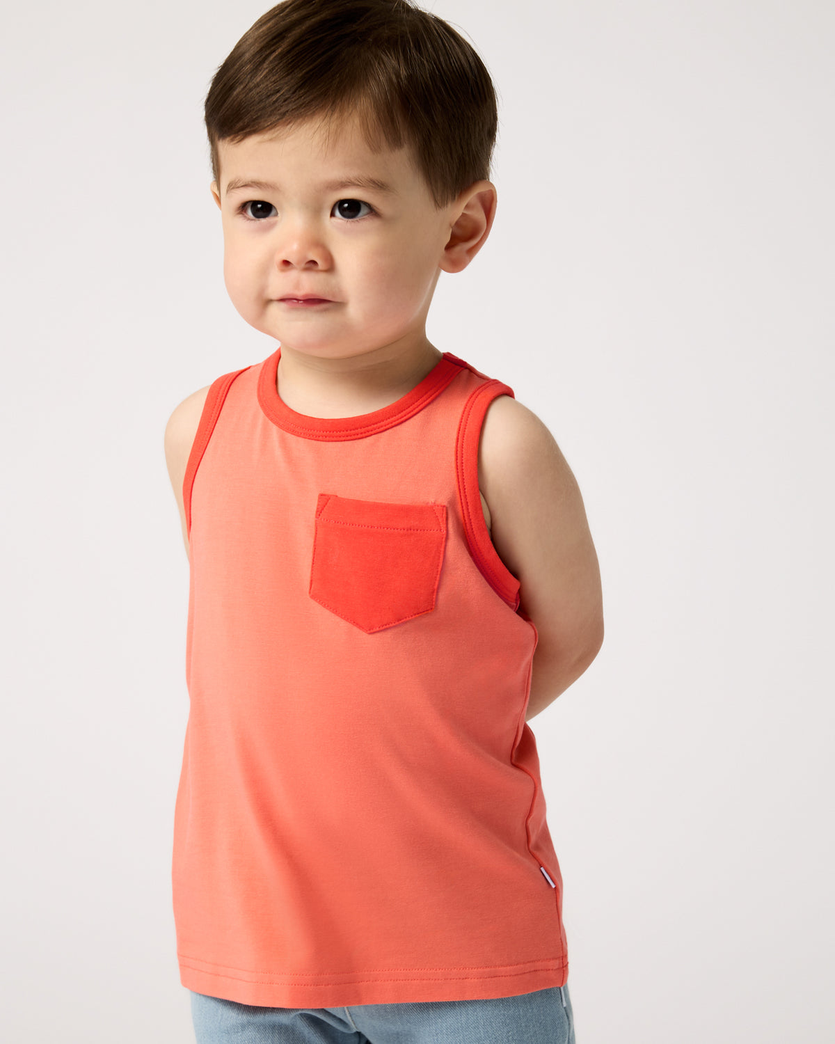 Toddler wearing the Orange Crush Pocket Tank