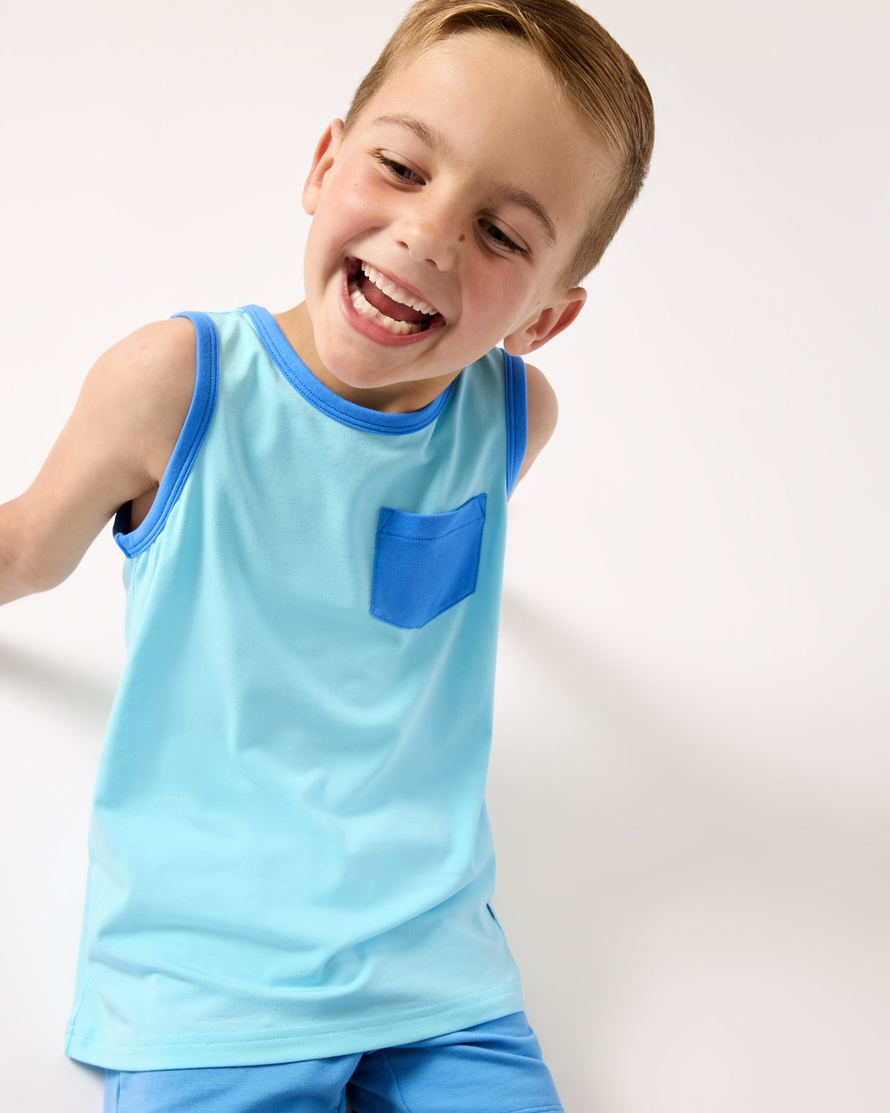 Boy wearing the Coastal Blue Pocket Tank