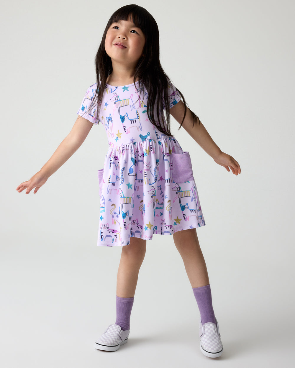 Girl wearing the Whiskers & Wags Purple Patch Pocket Dress