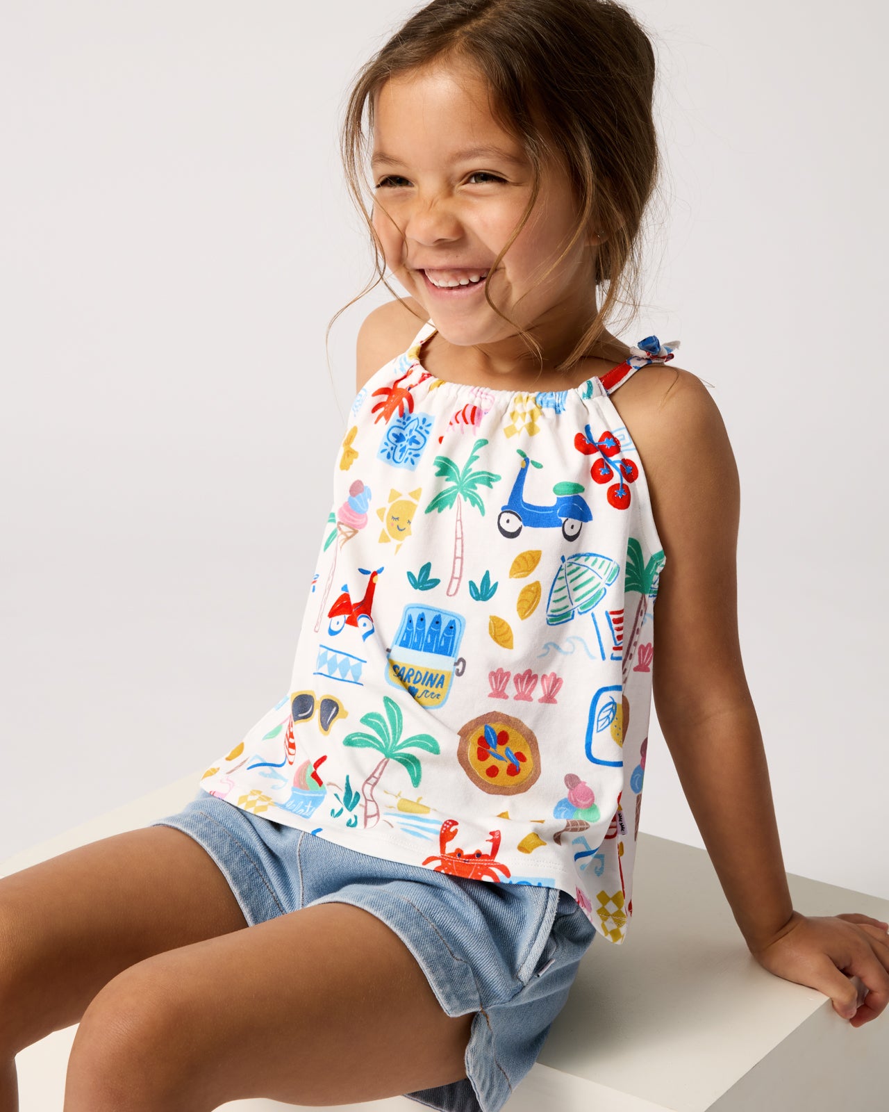 Girl wearing the Ciao Bella Bow Strap Tank