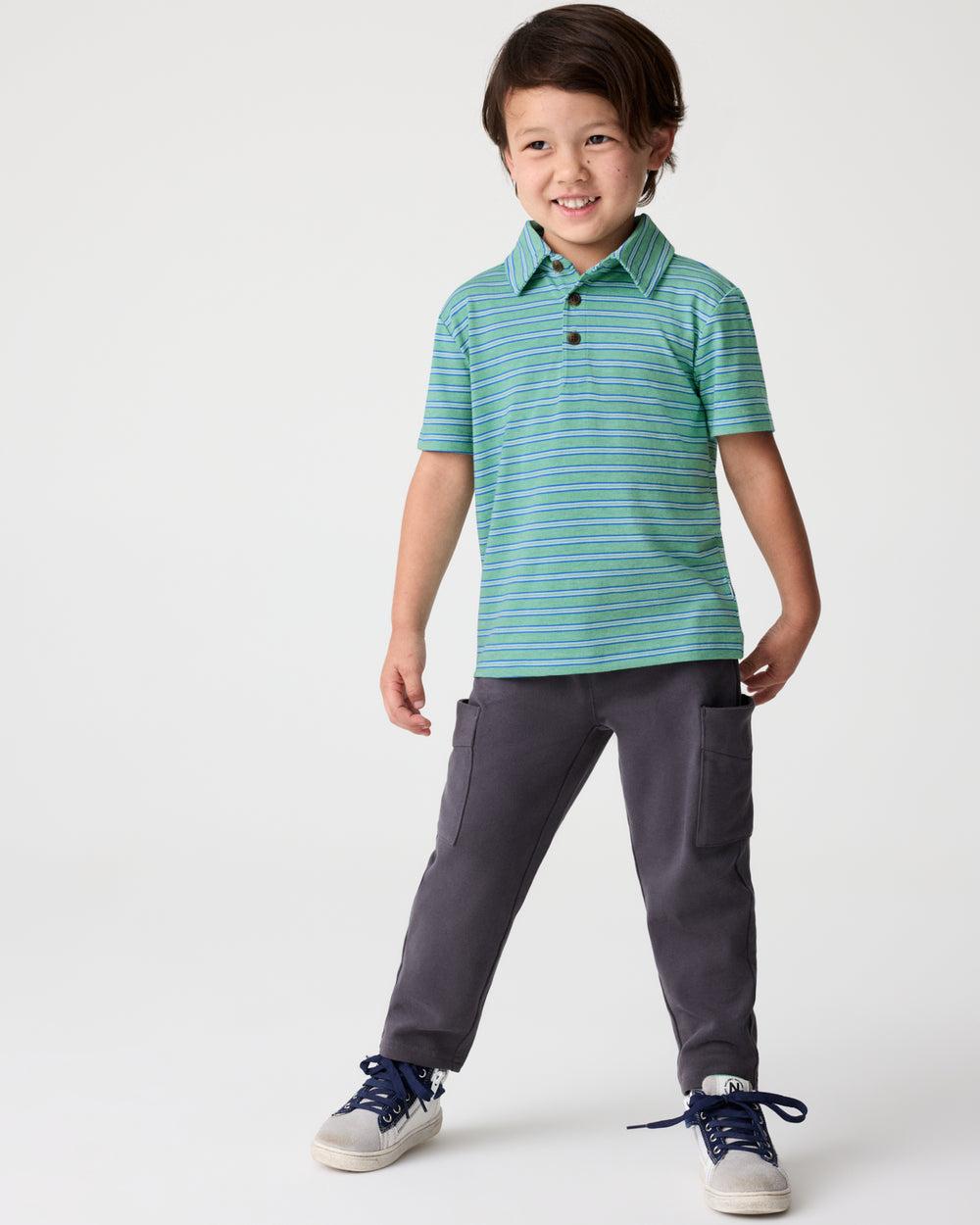 Boy wearing the Fresh Green Heather Stripes Polo Shirt with black cargo pants