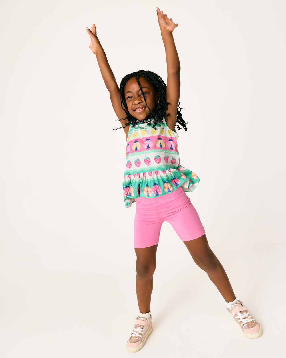 Posing child wearing the Sweet Pink Bike Shorts