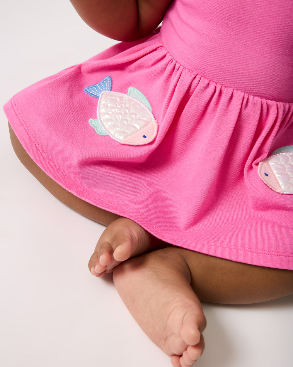 Close up of the graphic details on the Sparkling Scales Empire Tunic Top with Bloomer