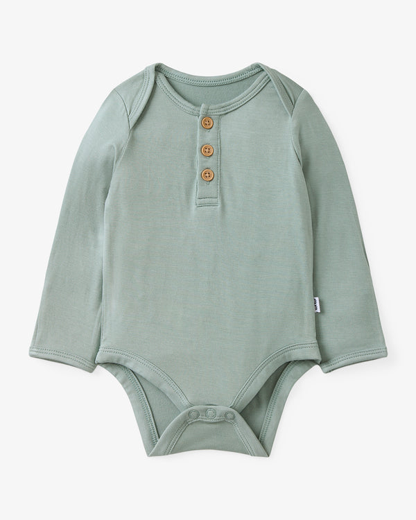 Flat lay of the Willow Henley Bodysuit