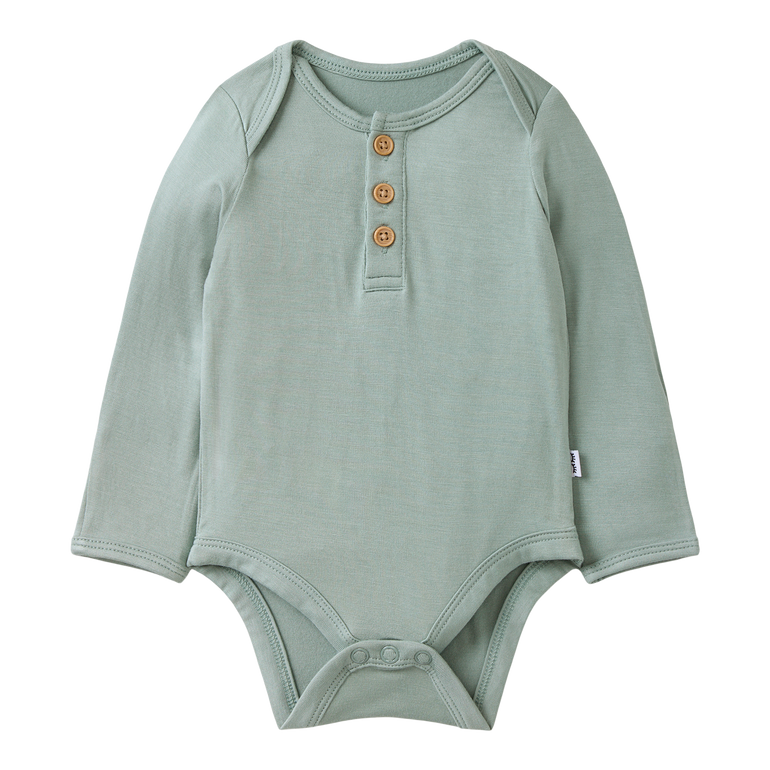 Green baby bodysuit with buttons on a white background