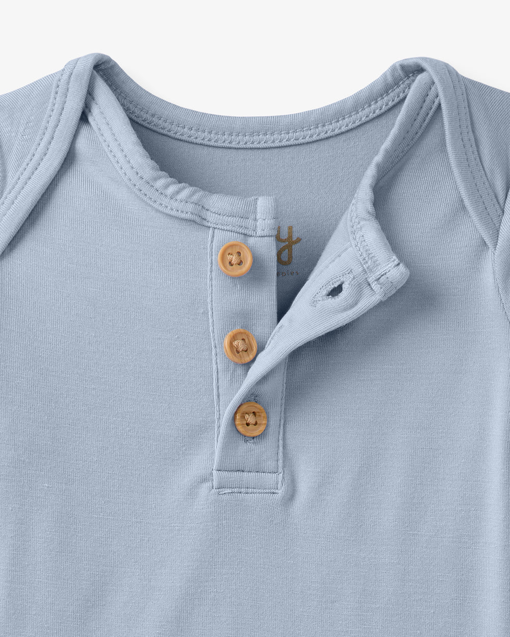 Close up flat lay of the Light Fog Henley Bodysuit