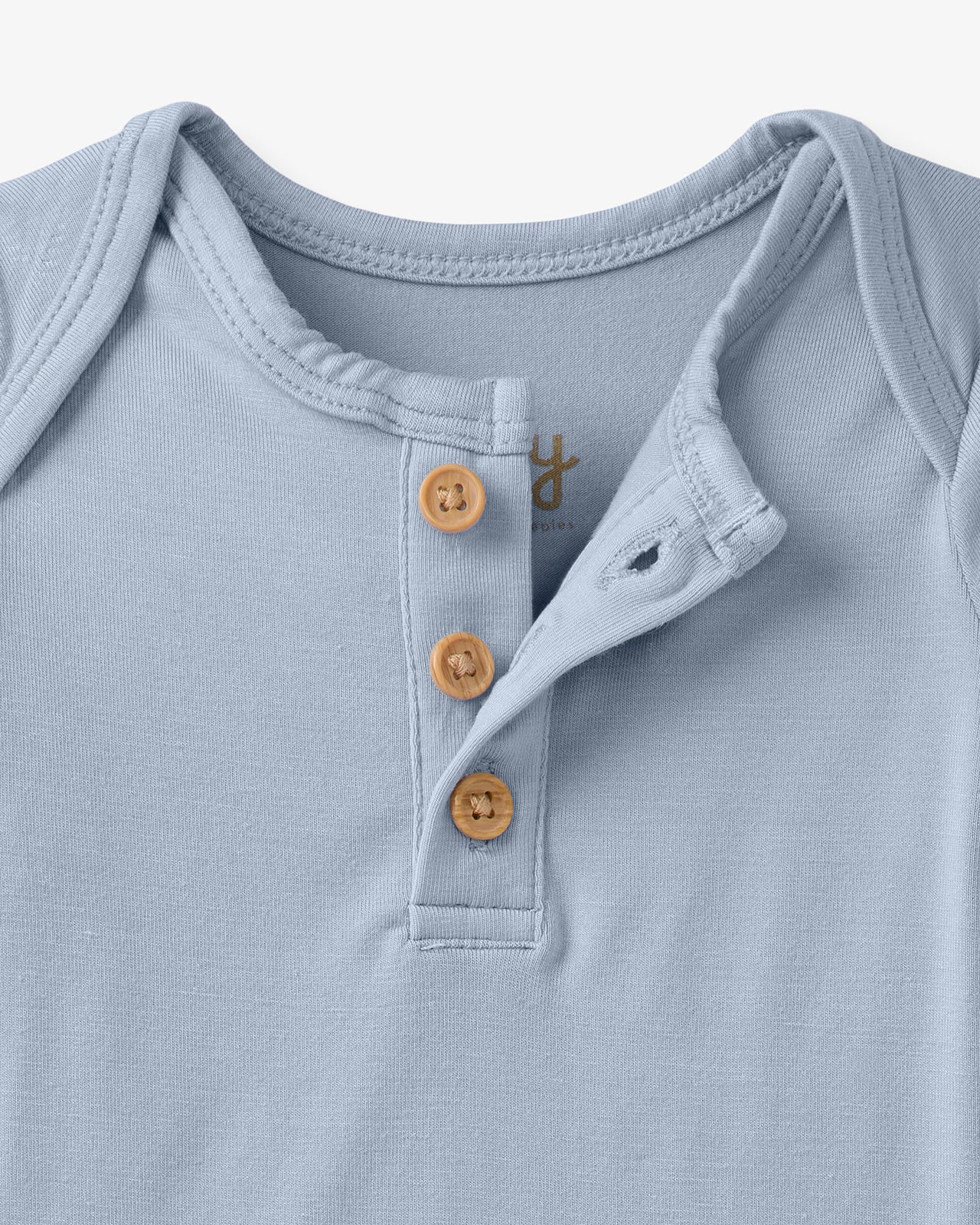 Close up flat lay of the Light Fog Henley Bodysuit