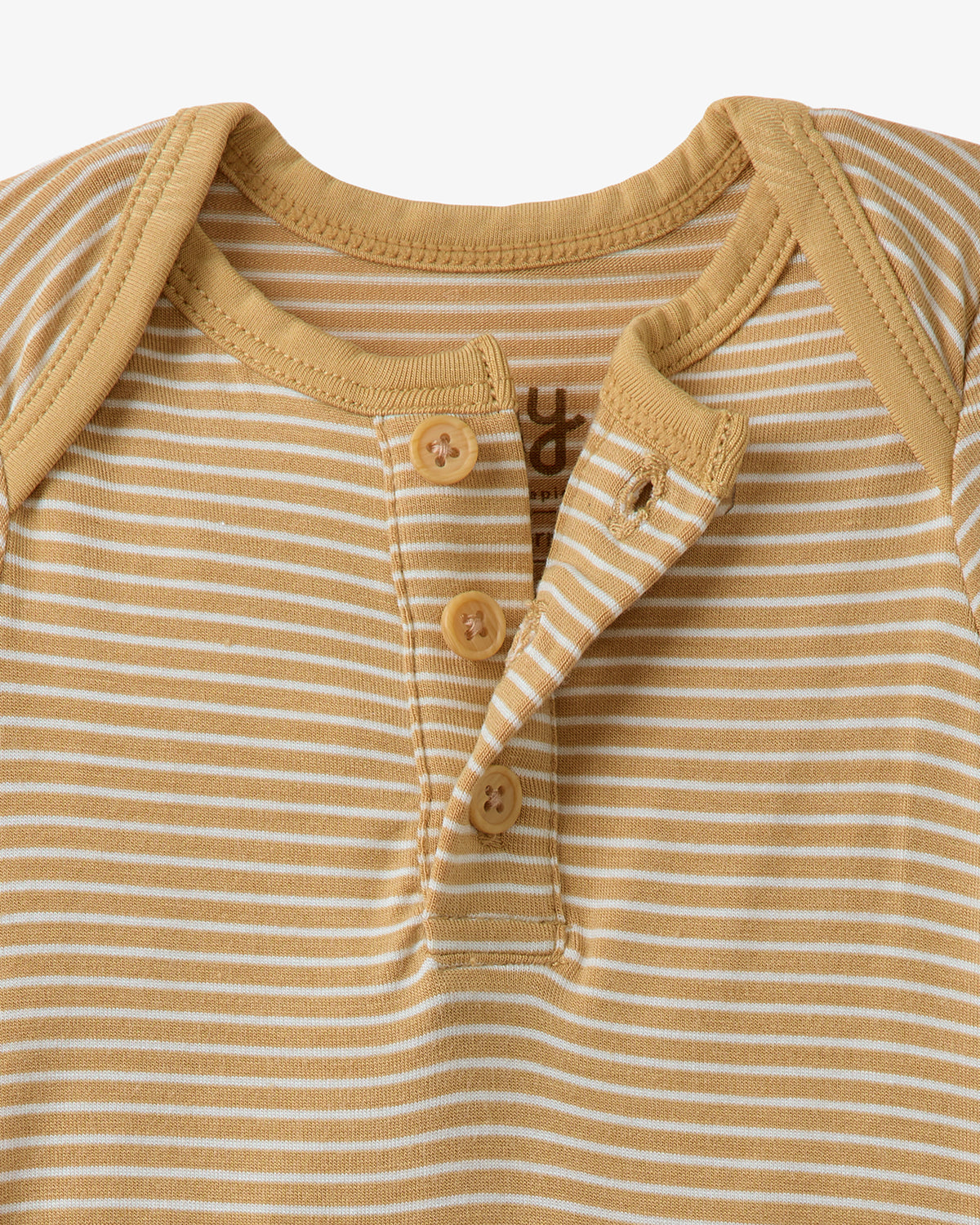 Close up of the button detail on the Hazel Wood Stripe Henley Bodysuit