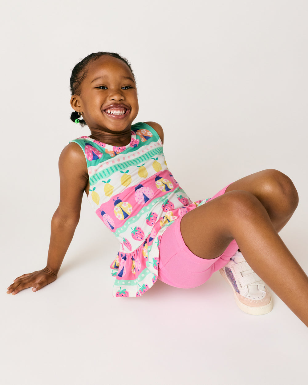 Sitting girl wearing the Sweet Pink Bike Shorts